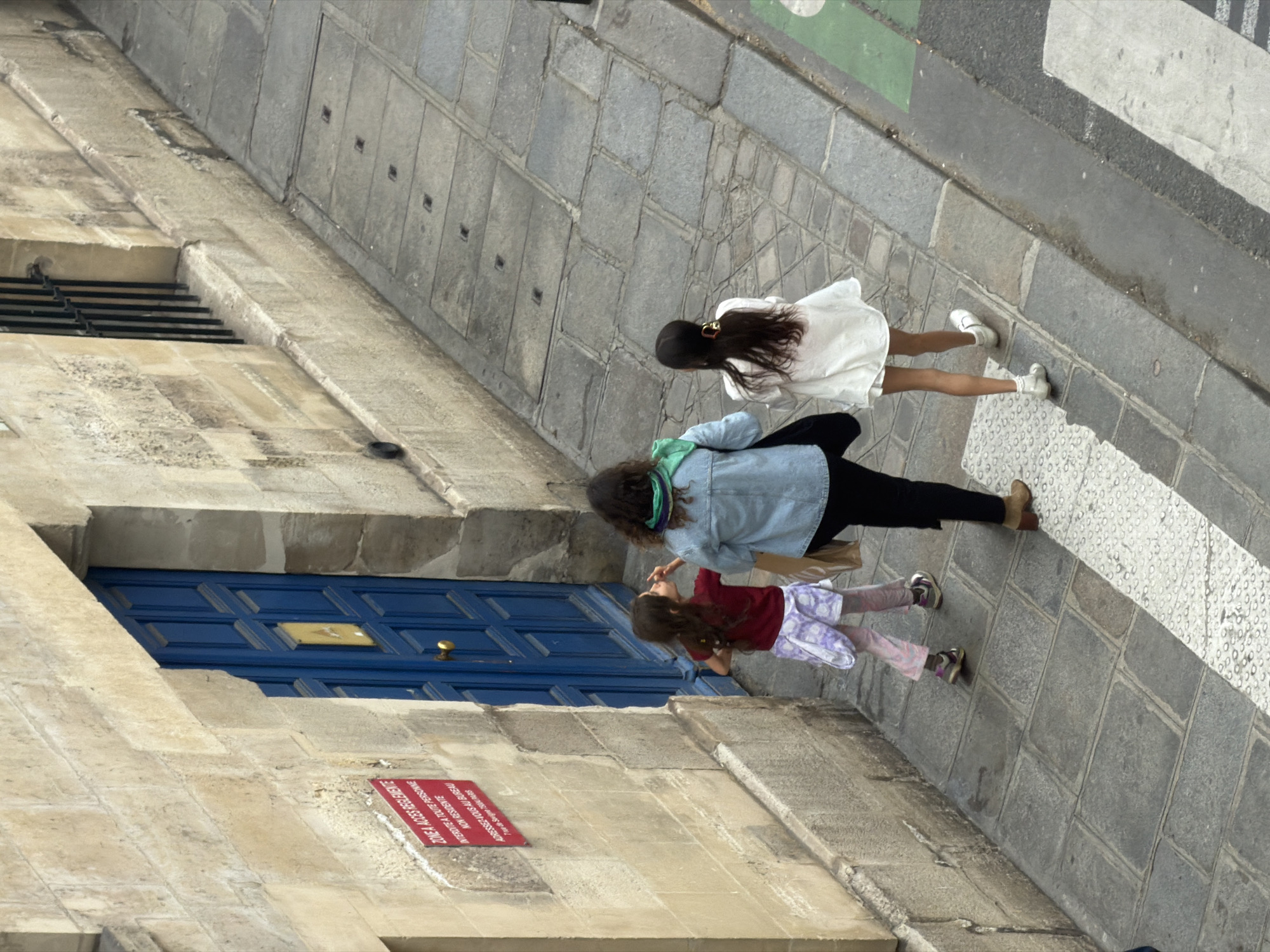 Pedestrians Navigate Paris Streets During Afternoon Rush