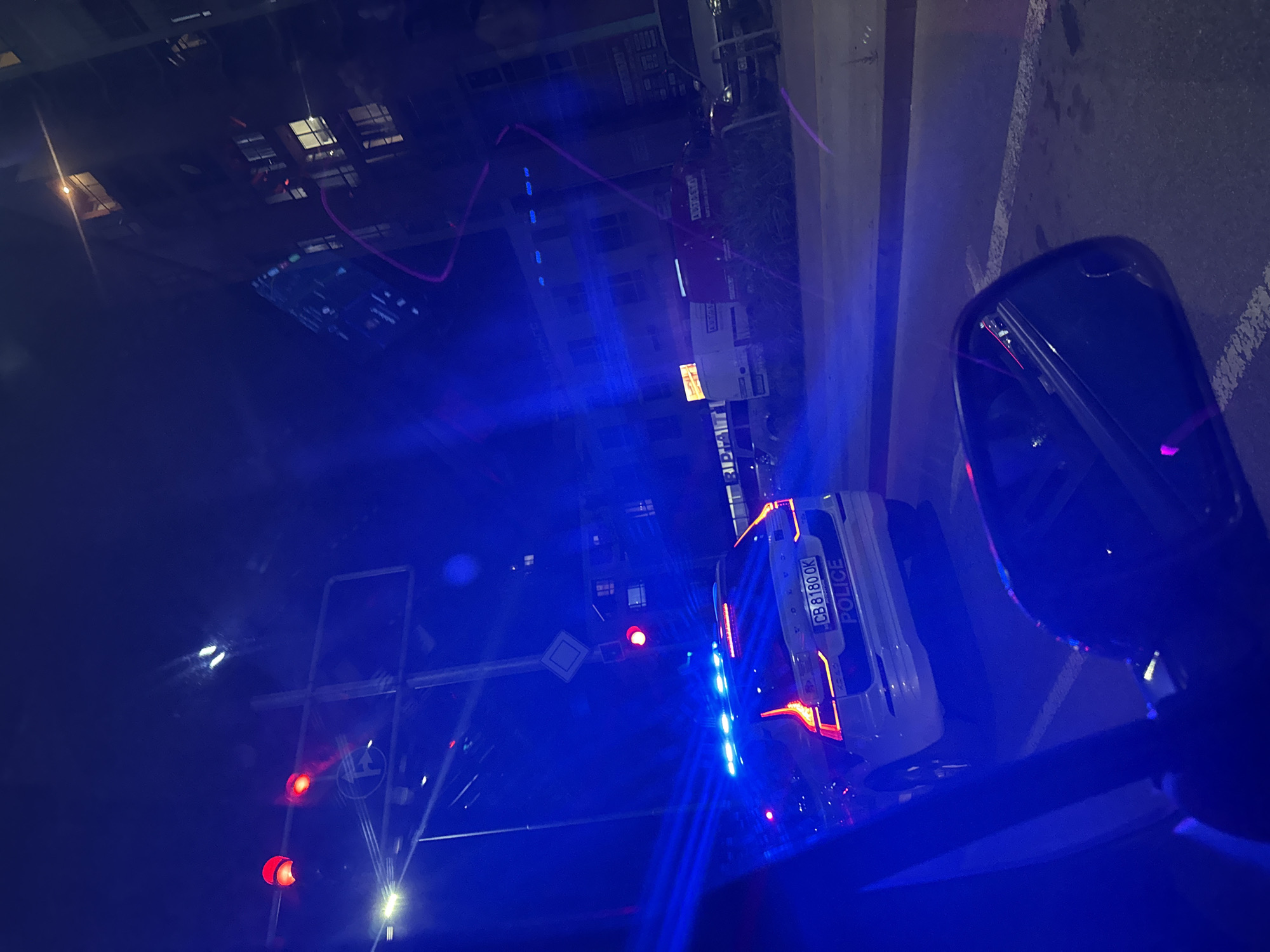 Police vehicle with emergency lights active at Plovdiv intersection