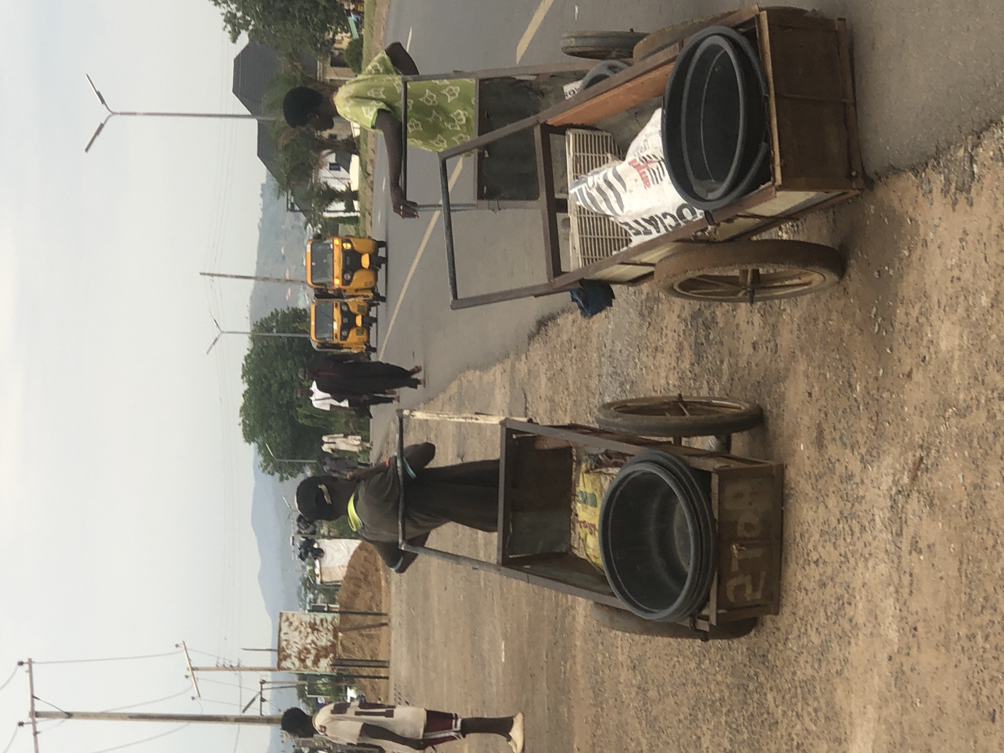 Cart vendors transport goods on Abuja street