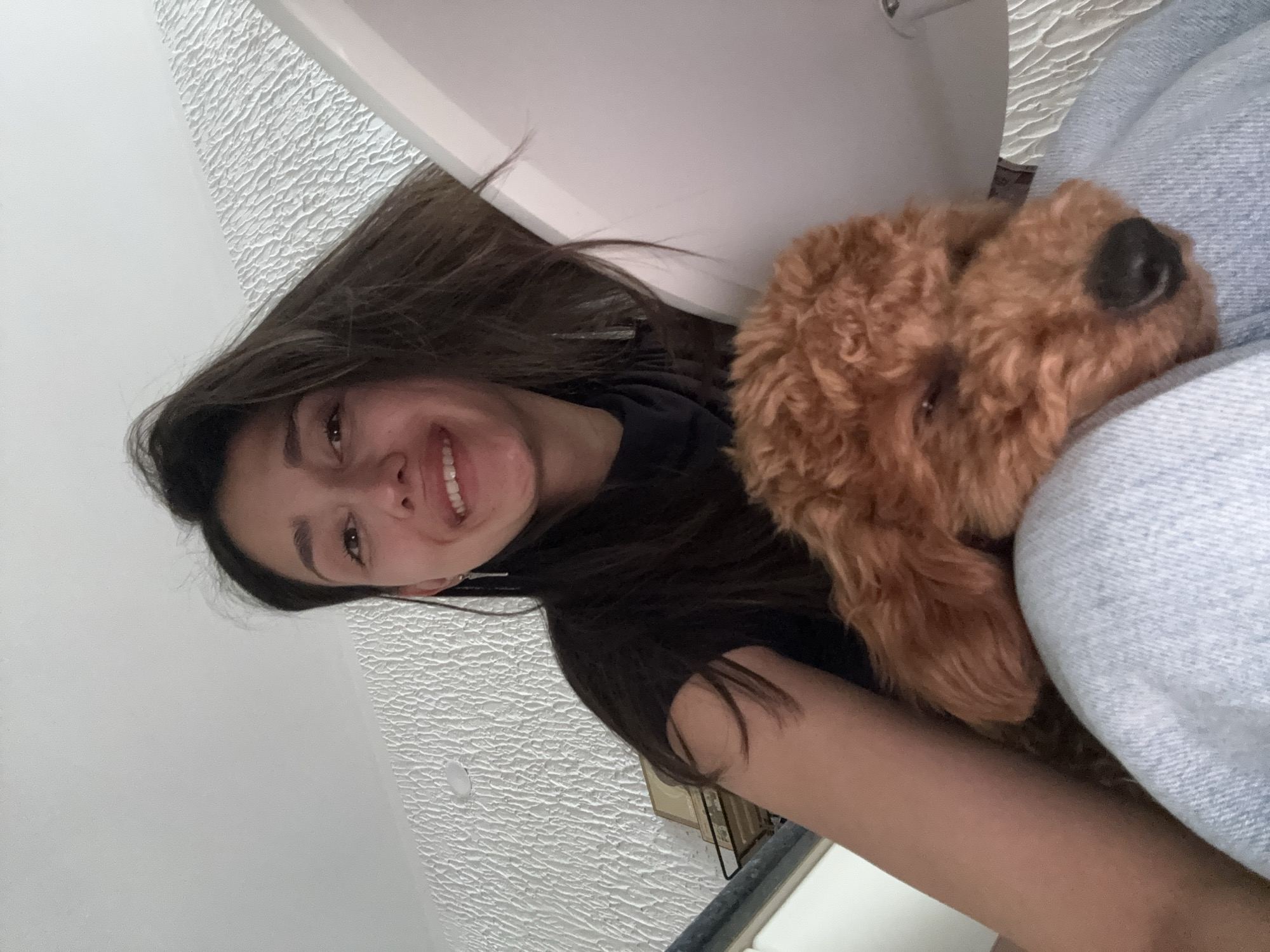 Woman photographed with dog in Sutomore, Montenegro