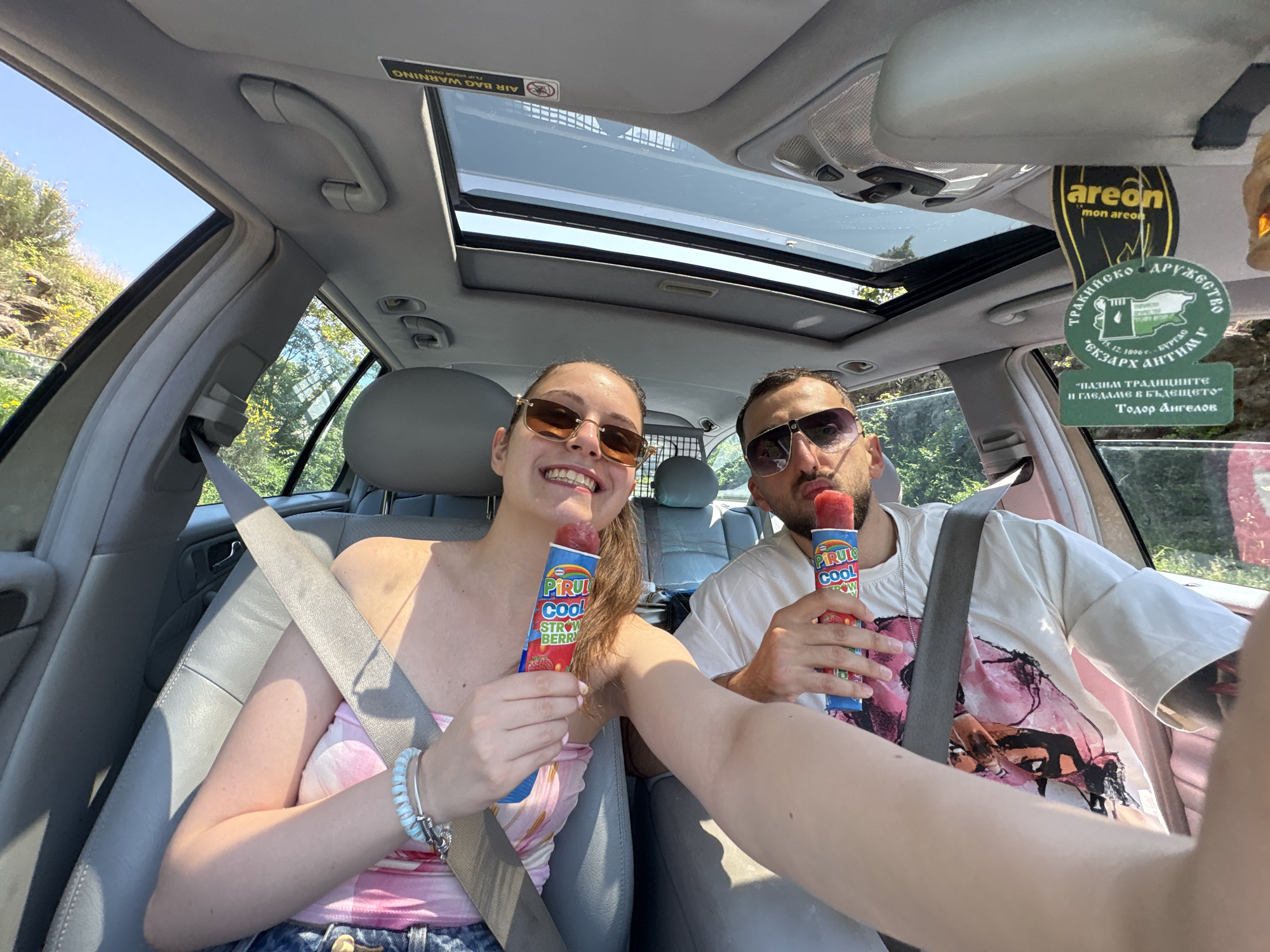 Couple photographed in car during sunny day in Tsarevo