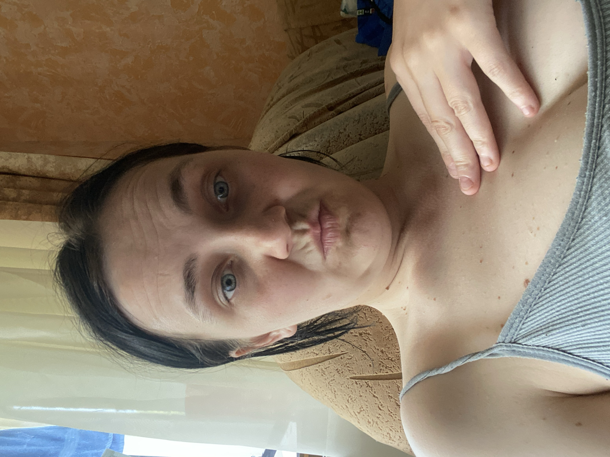 Gray tank top selfie series, multiple expressions