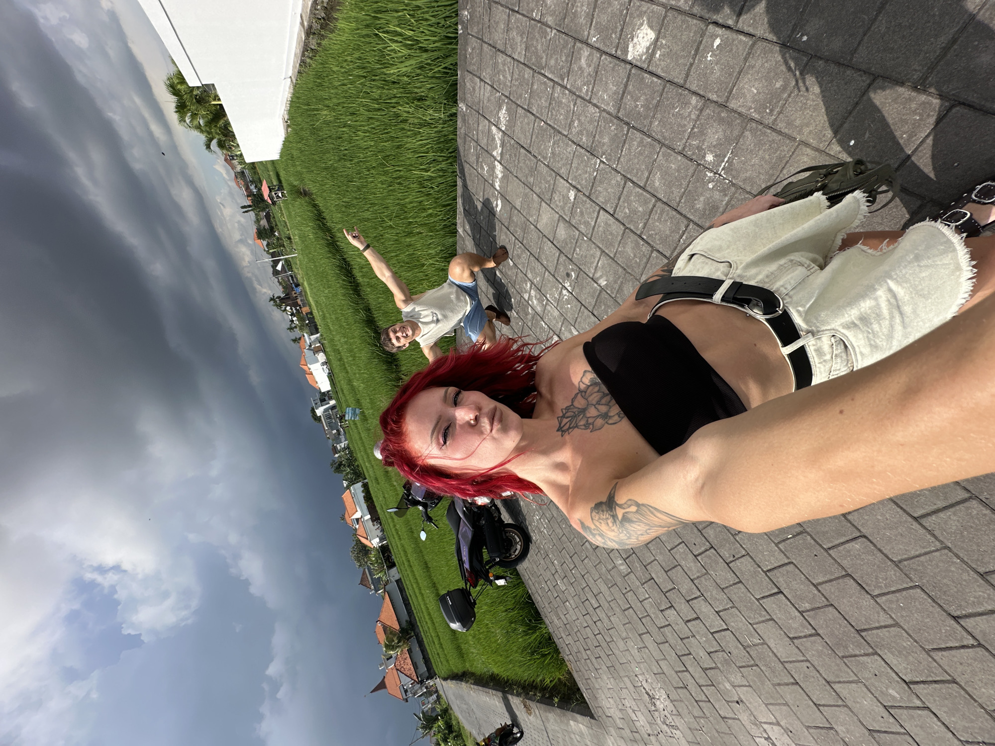 Tourist takes morning selfies near rice fields in North Kuta