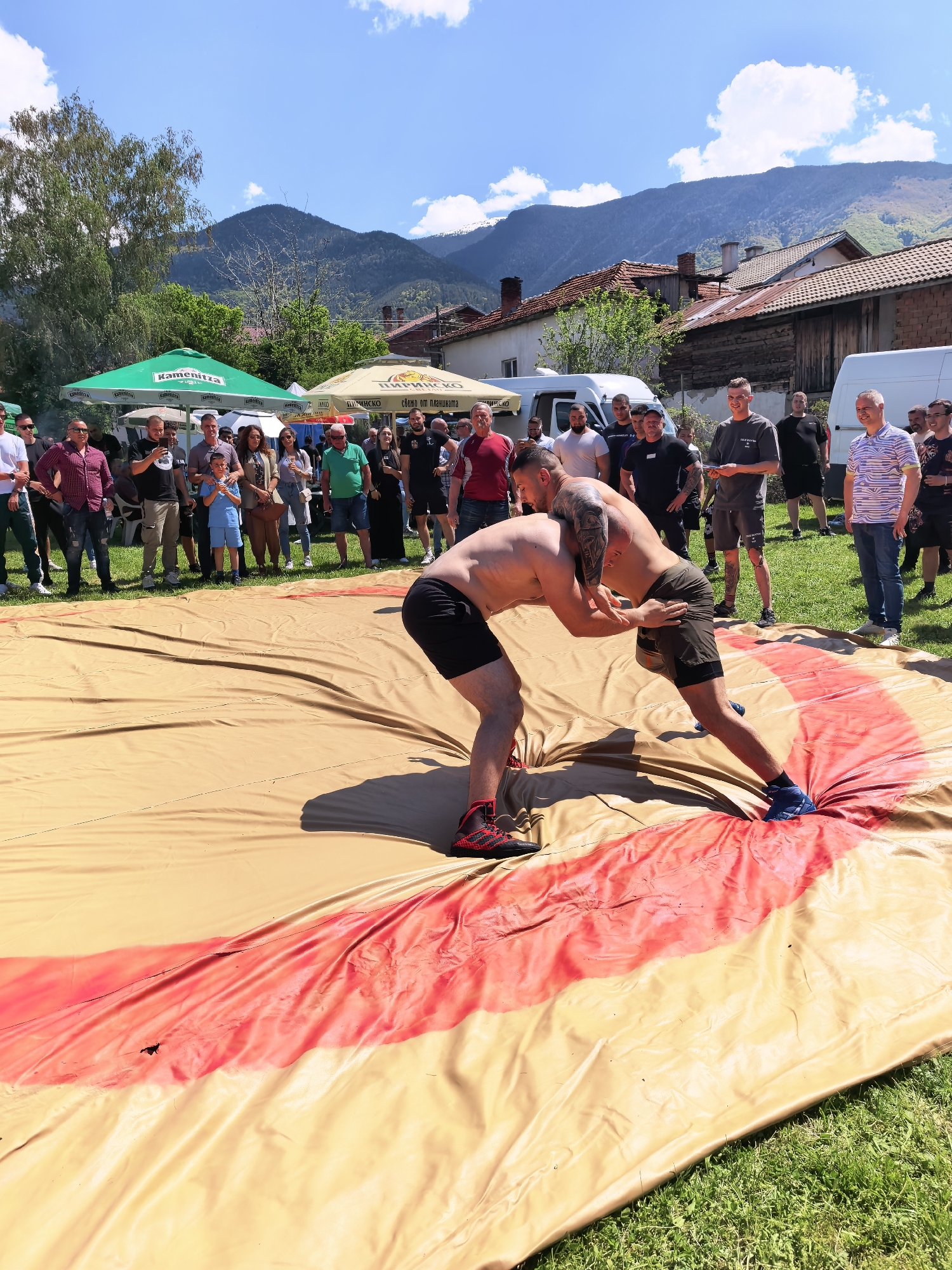Outdoor wrestling match draws crowd in Sapareva Banya, Bulgaria