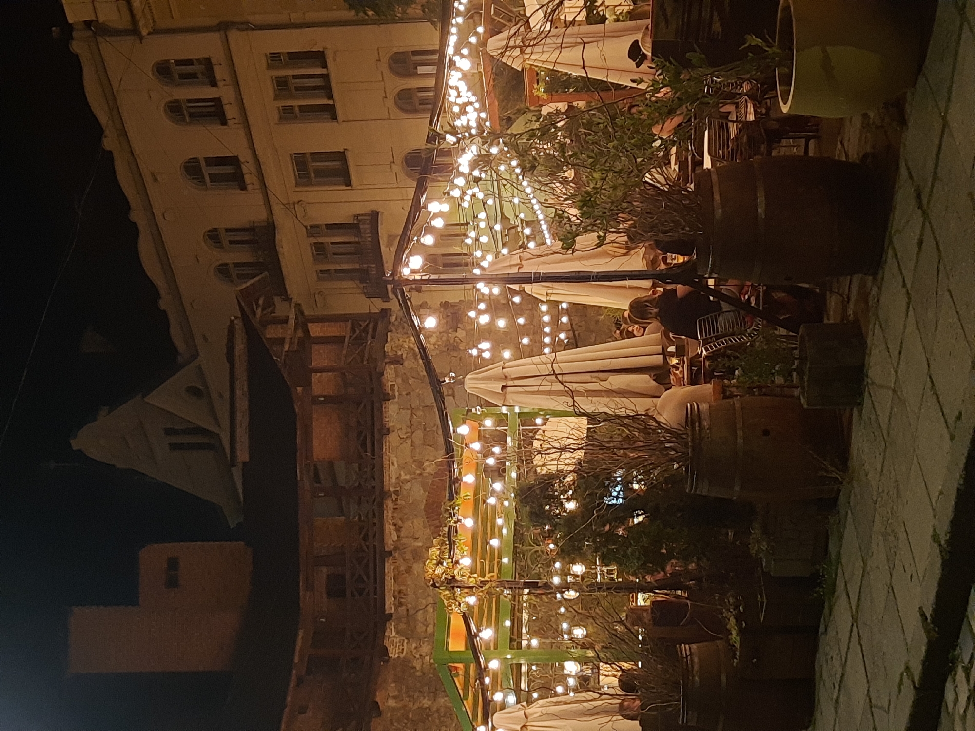 Lviv's lit-up old town café scene on a summer night