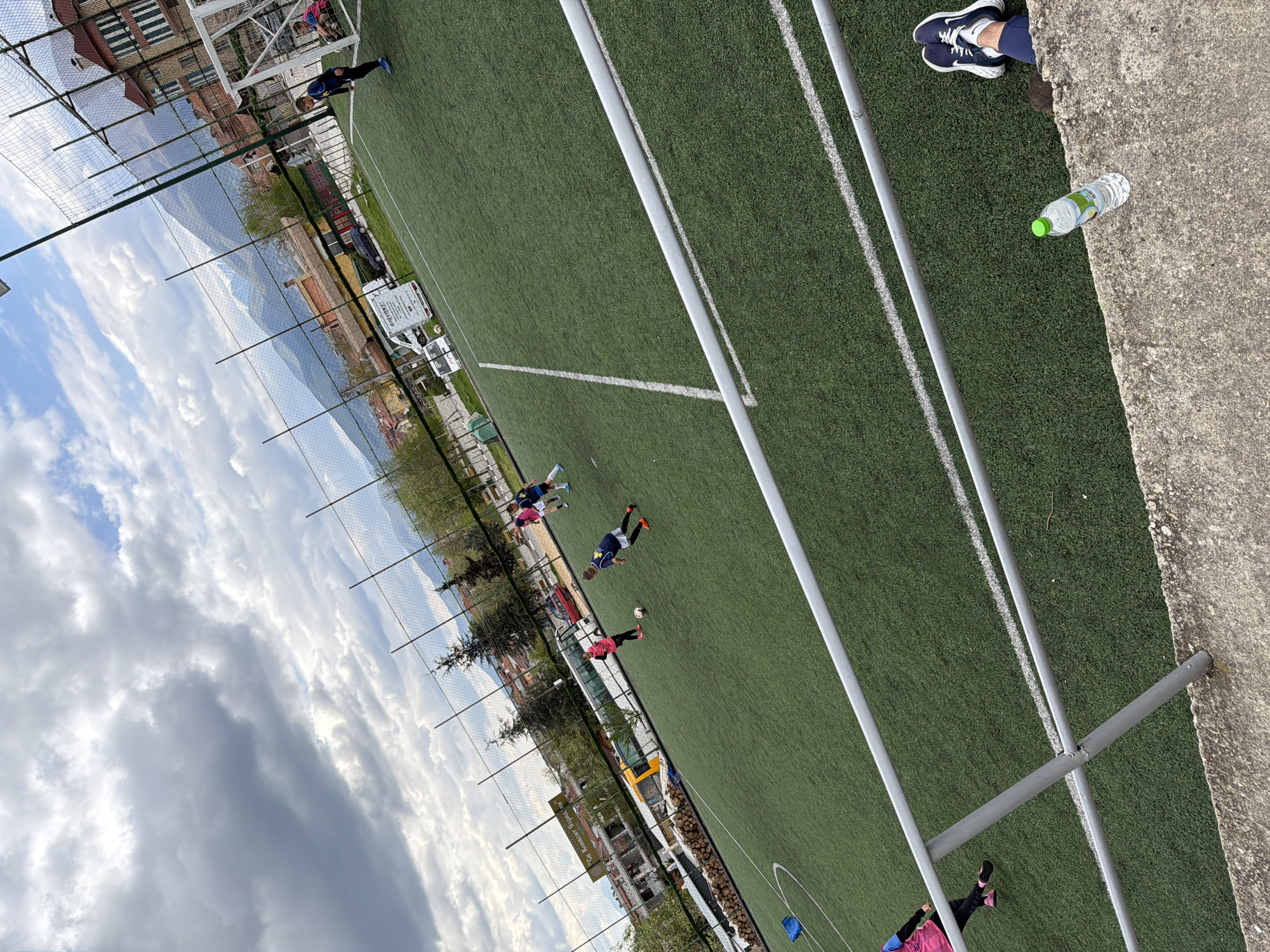 Soccer game observed on field in Debren, Bulgaria
