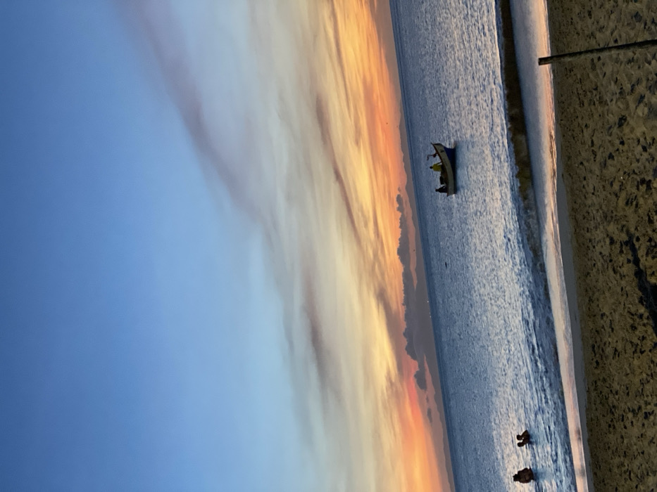 Sunset beach gathering captured at Juan Griego, Venezuela