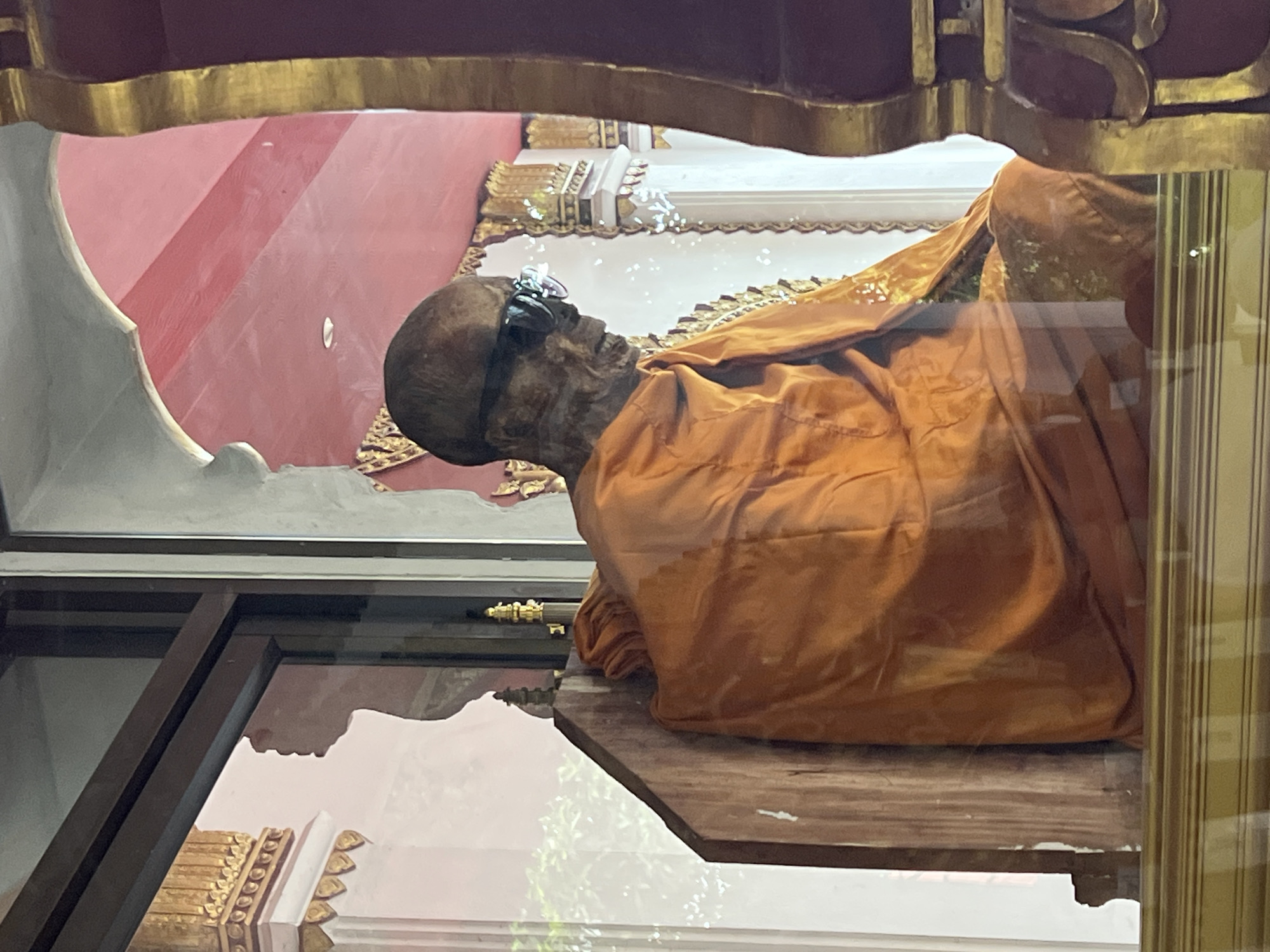 Mummified monk in glass enclosure, Ko Samui temple