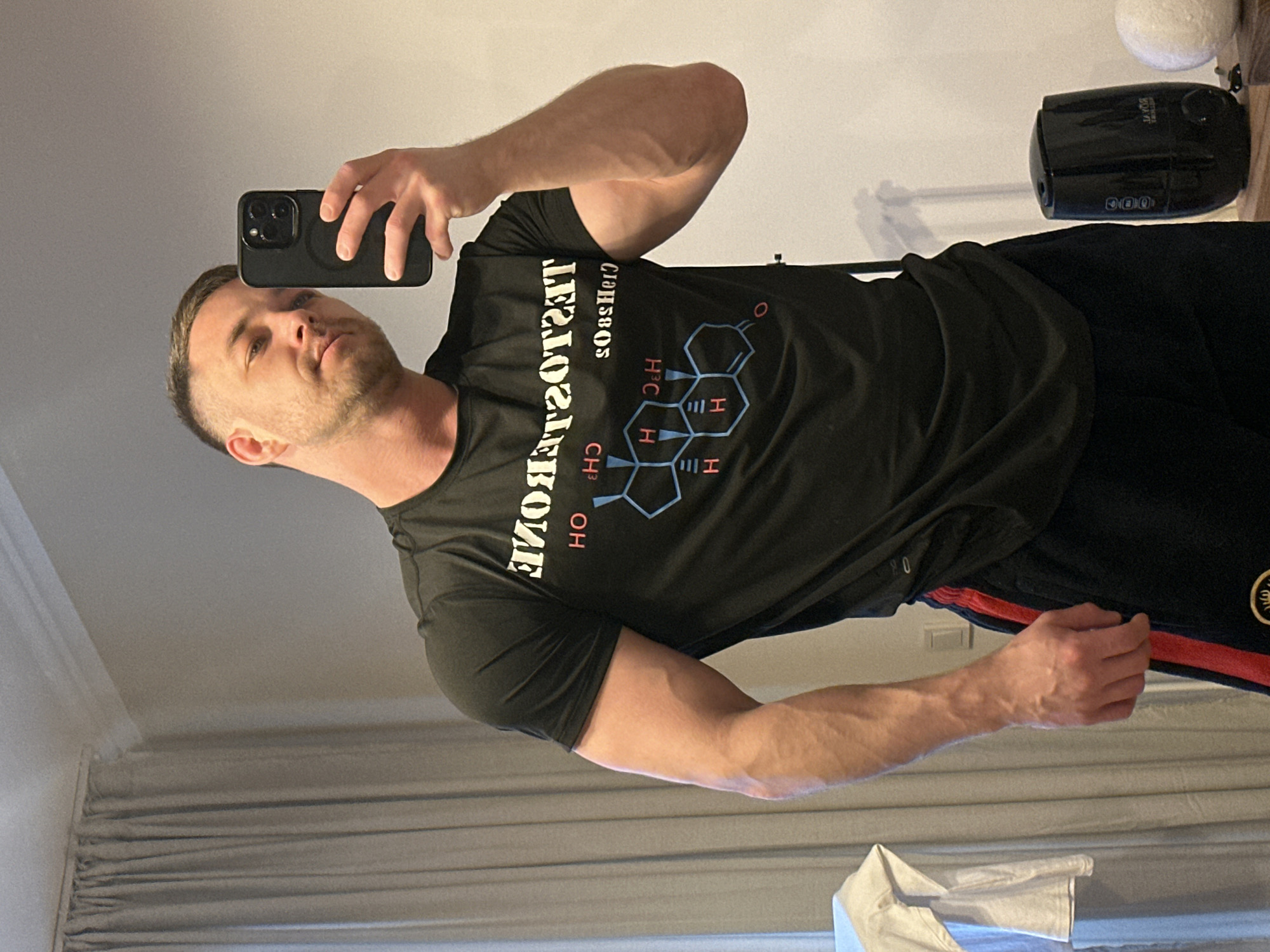 Man takes flexing selfies in mirror in Perm, Russia