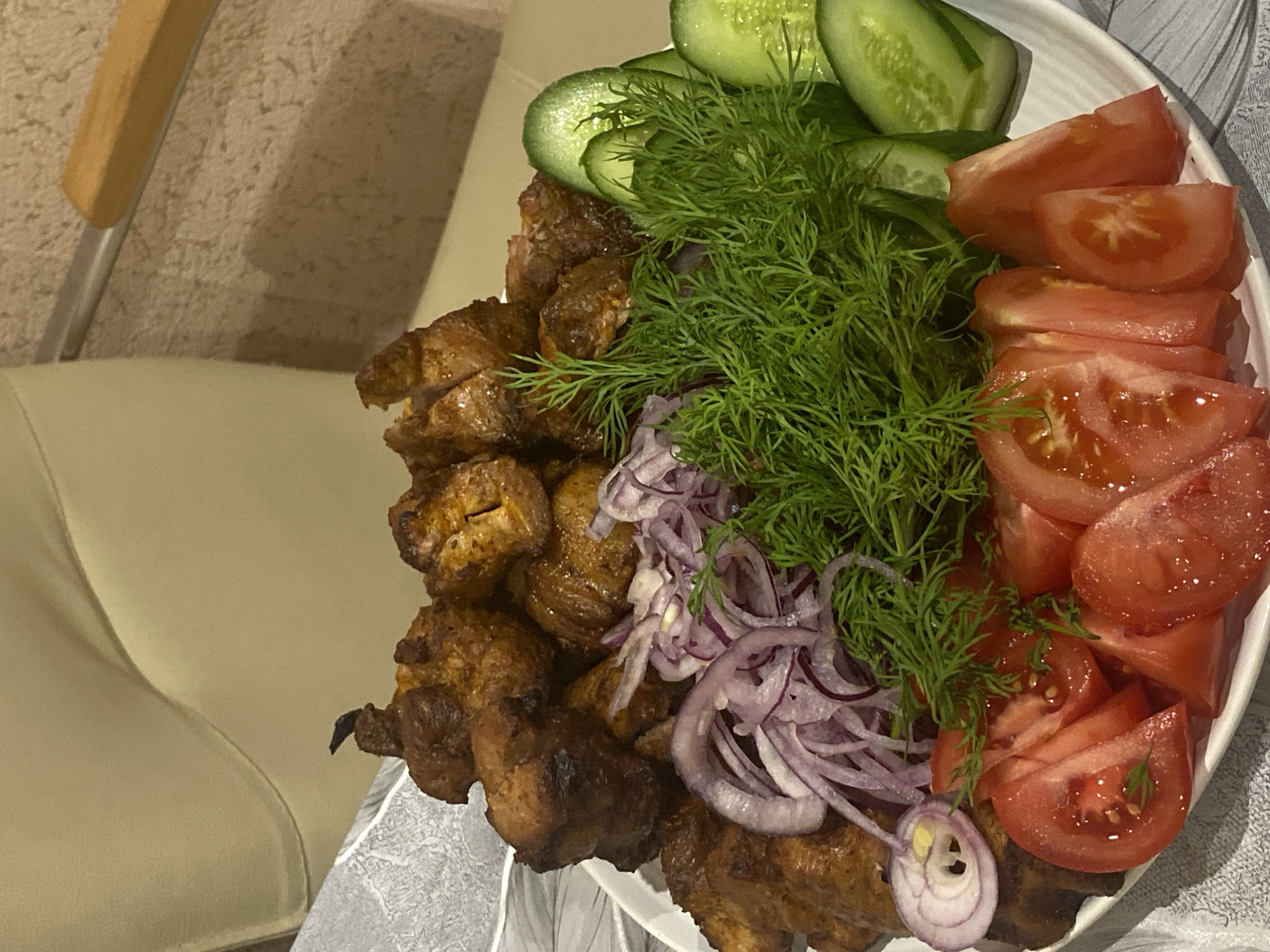 Family enjoys traditional grilled meal in Sochi home