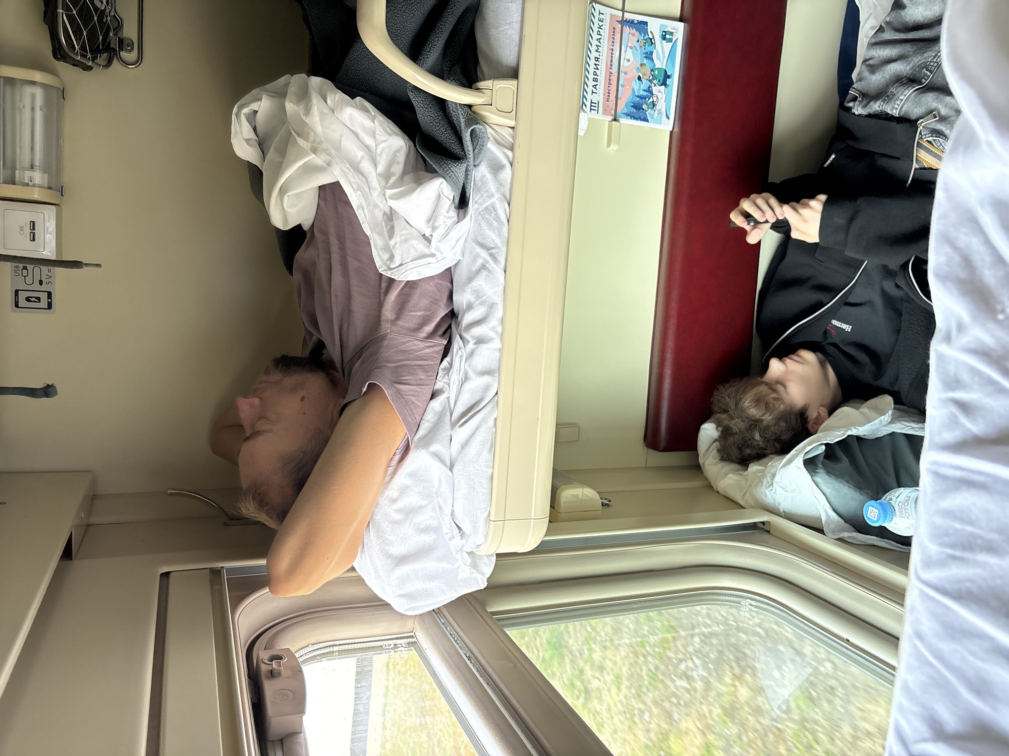 Passengers sleep in bunks on train near Dzhankoy, Ukraine