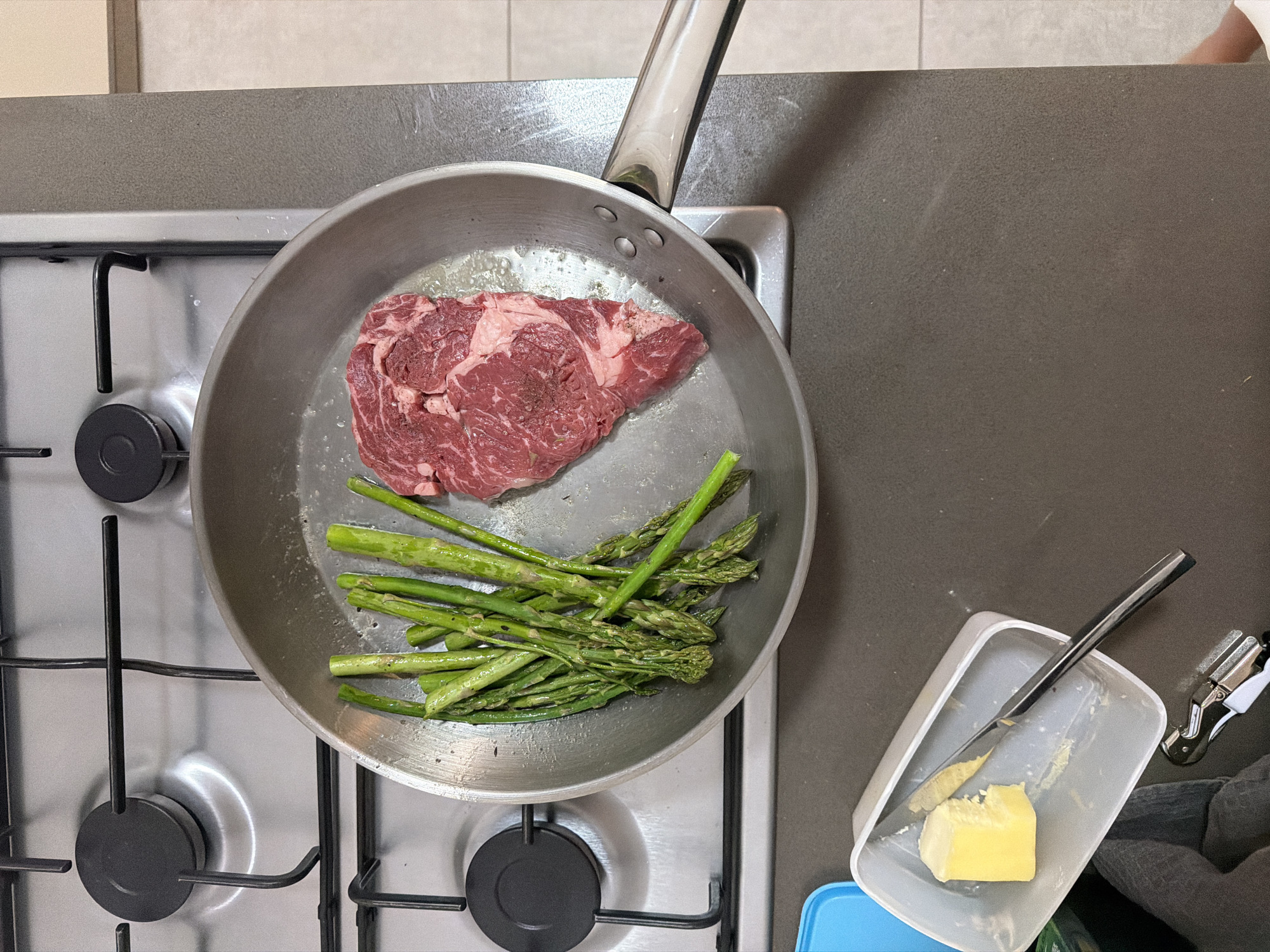 Home cook prepares ribeye steak in Holon kitchen