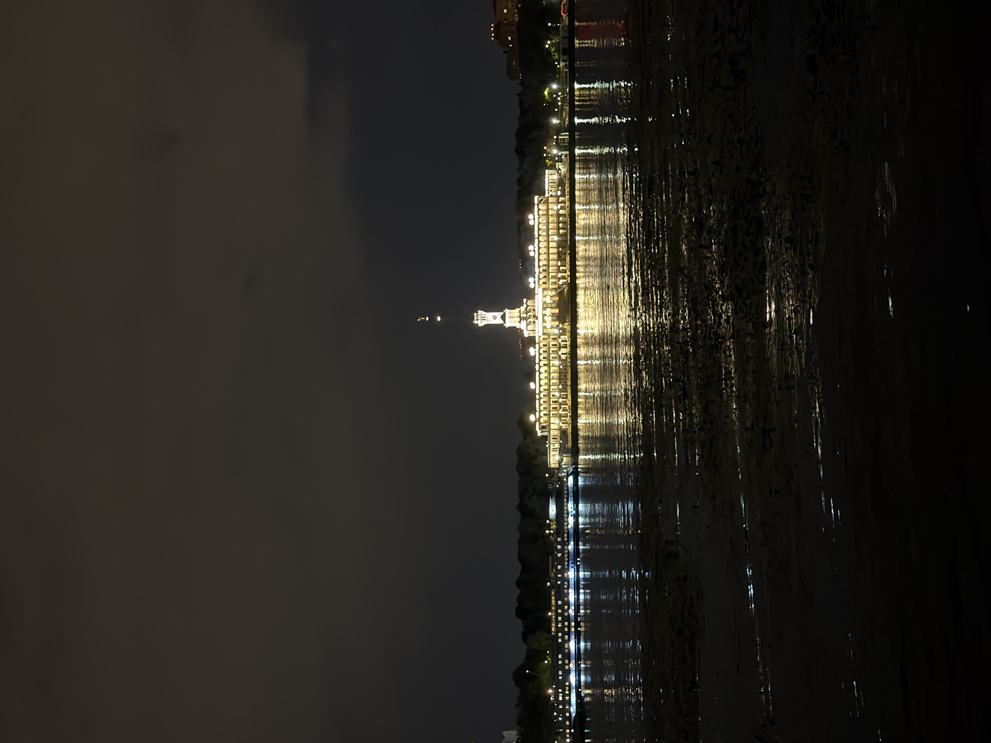 Khimki's river terminal lit up on a summer night