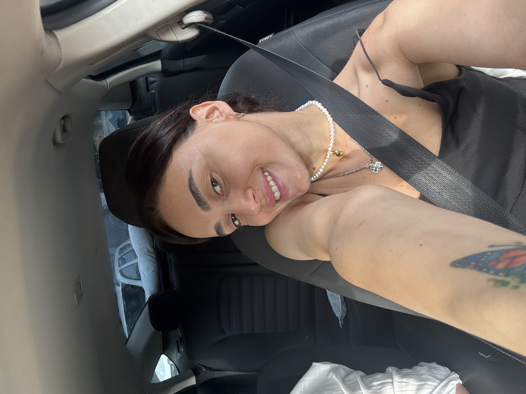 Woman Takes Selfies During Early Morning Car Journey in Tbilisi