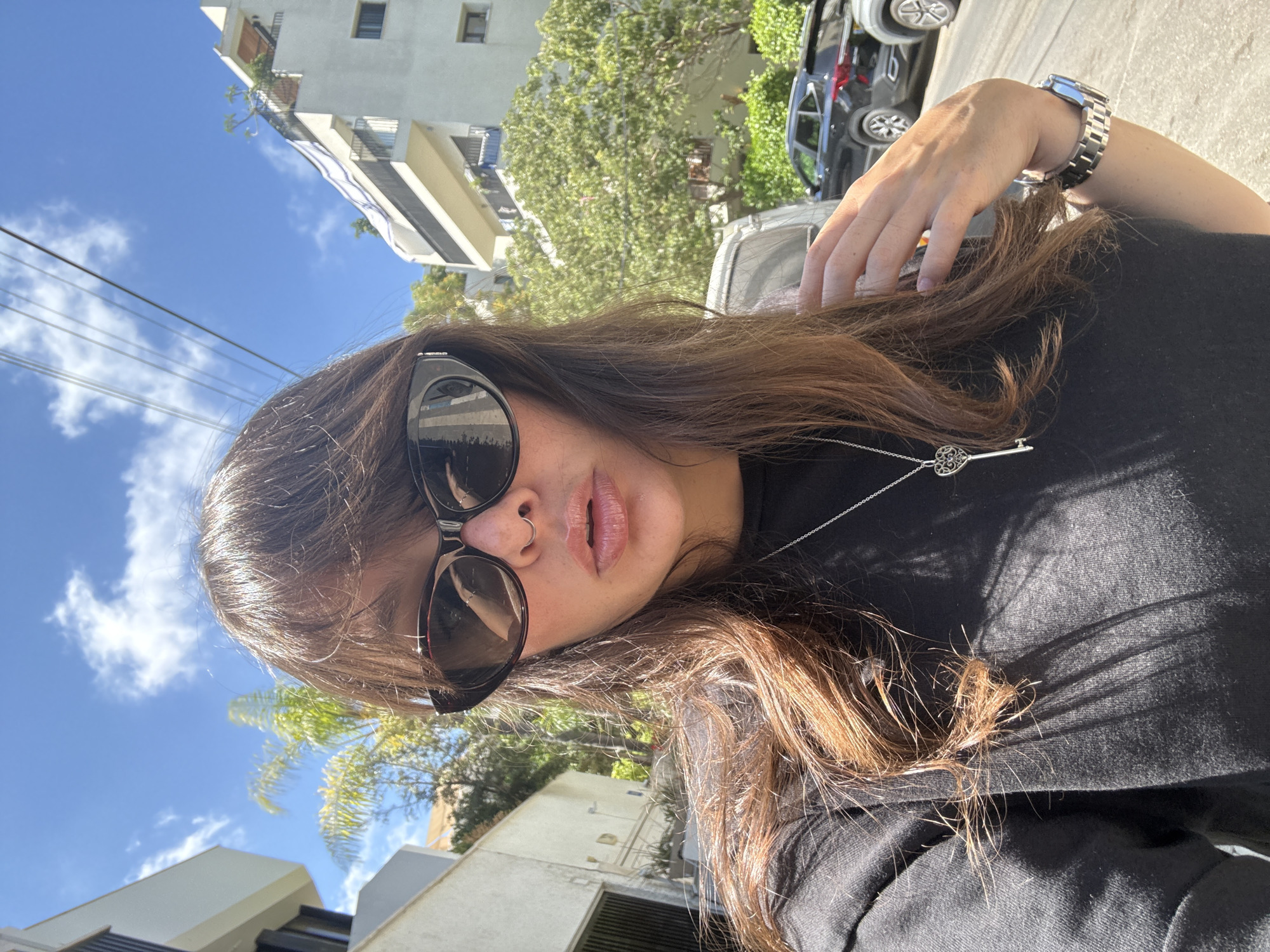 Street selfie and parked cars in Tel Aviv neighborhood