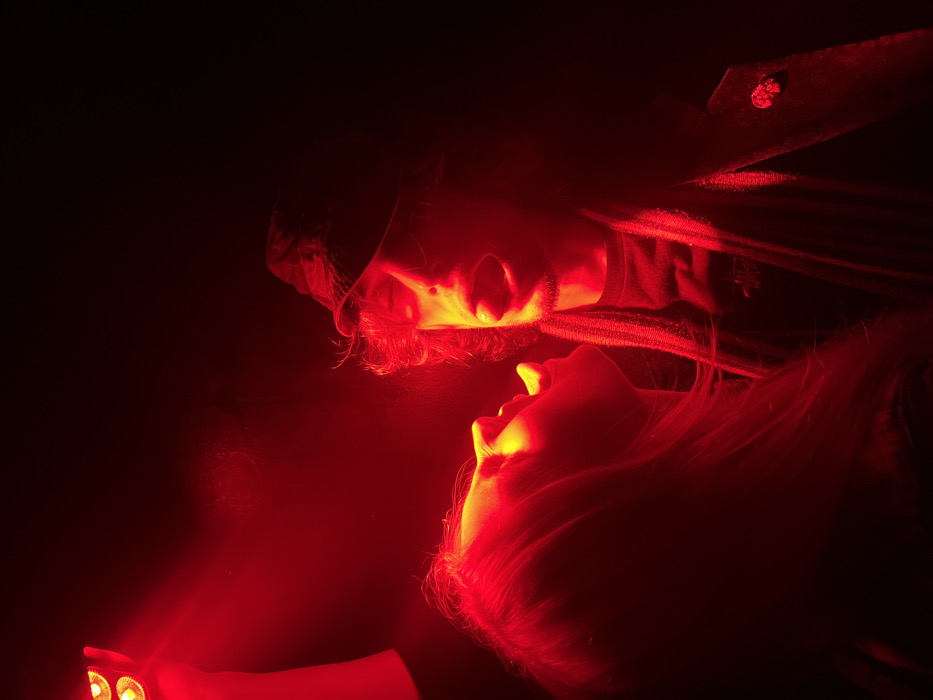 Paris nightclub scene captured in red-lit underground venue