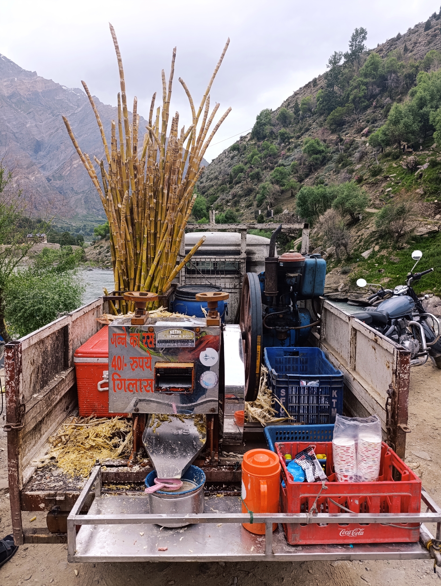 Roadside sugarcane juice stop beside a glacial river in Gondhla