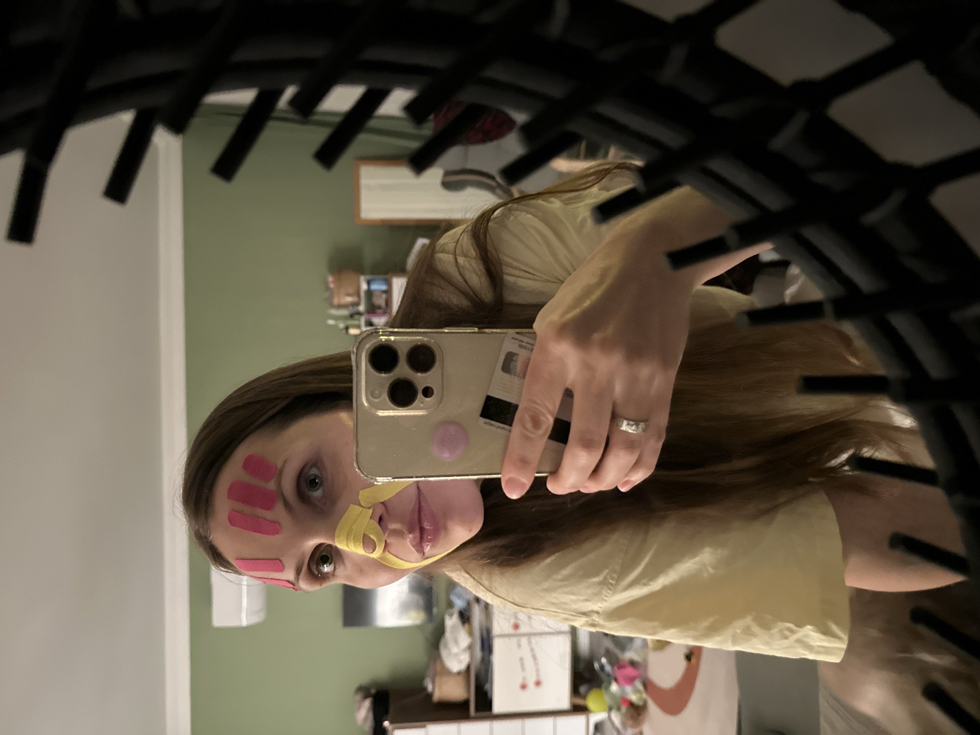 Woman documents skincare routine with kinesiology tape in Fethiye