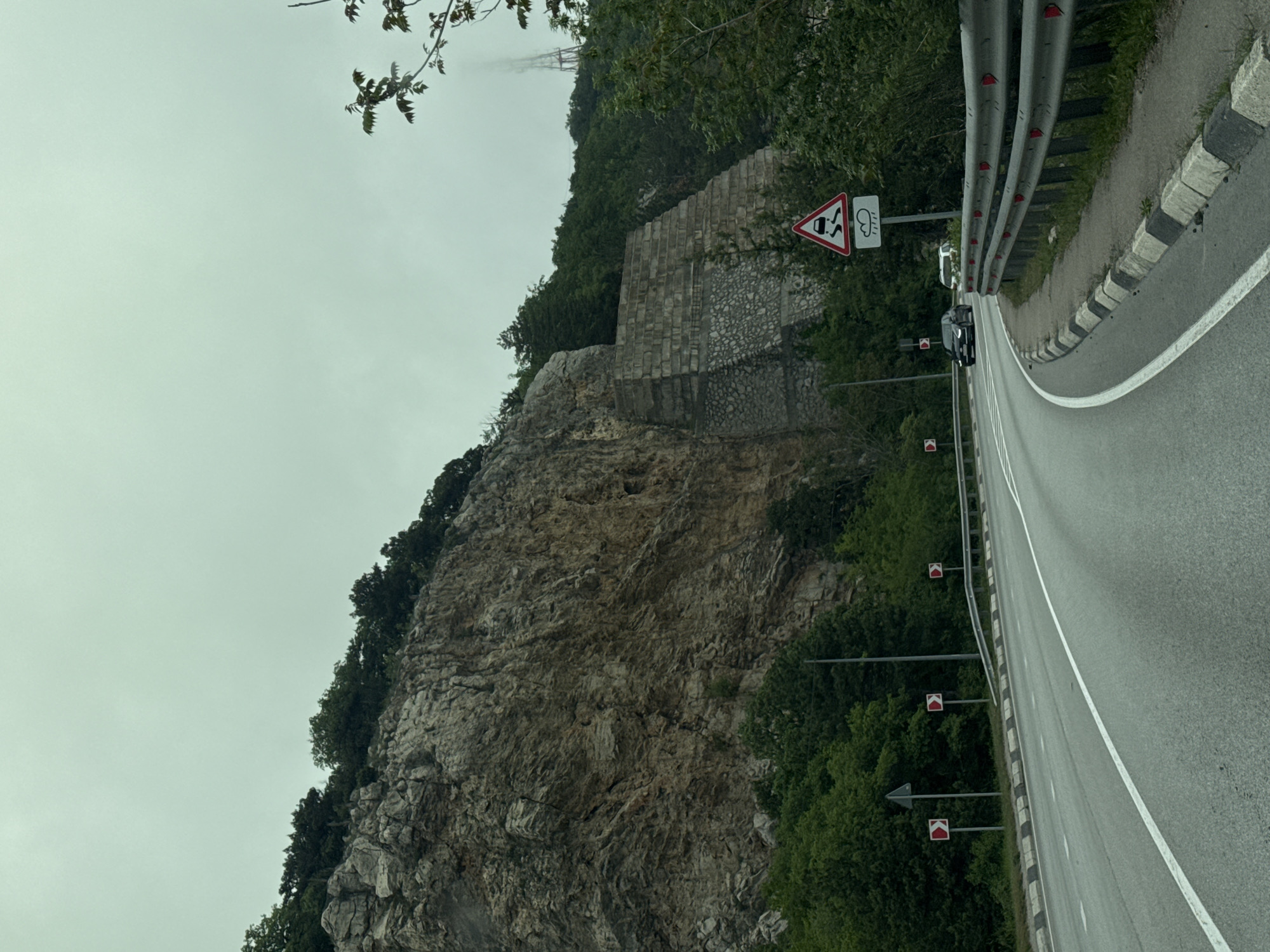 Clifftop road with guardrails observed in Crimean coastal community