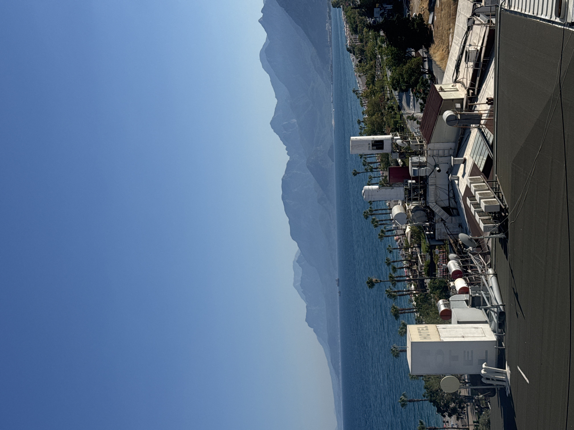 Konyaaltı beachfront and hotel scene on a sunny afternoon