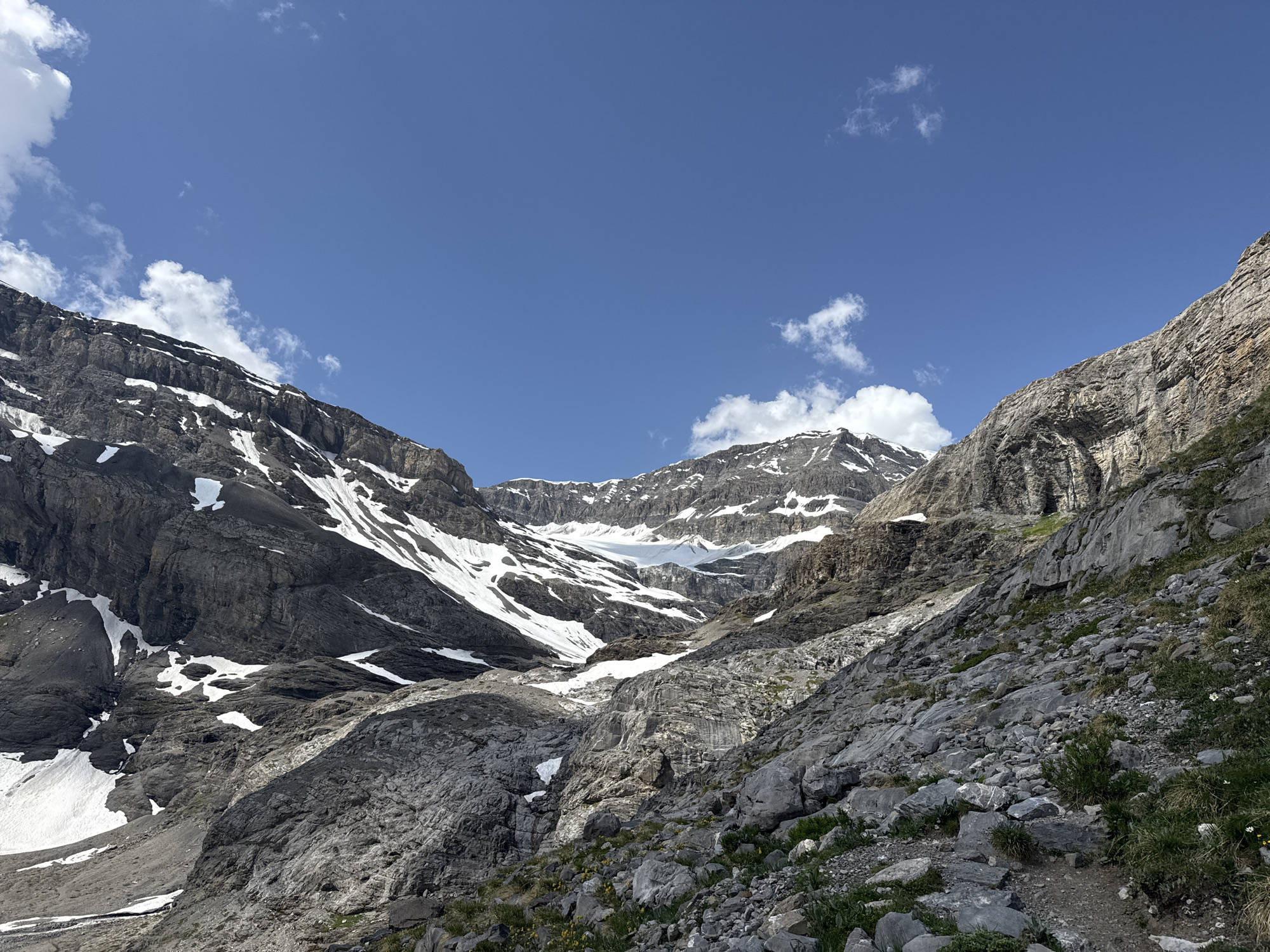 Alpine morning in Leukerbad: peaks, snow, and a braided riverbed