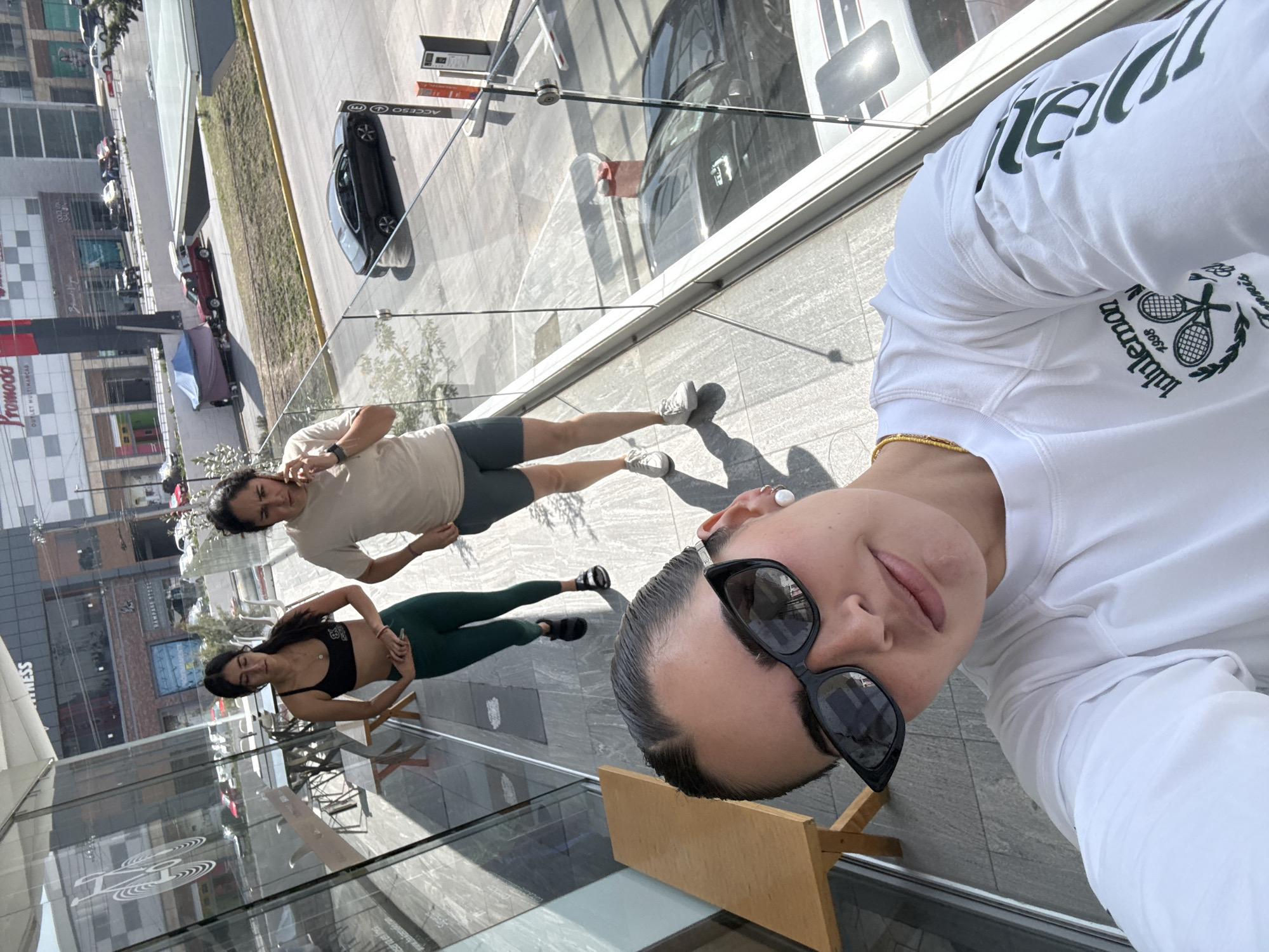 Three women photograph shopping trip at Puebla outlet mall