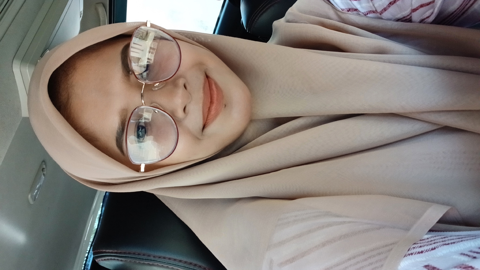 Woman takes car selfie in Lhokseumawe, Indonesia