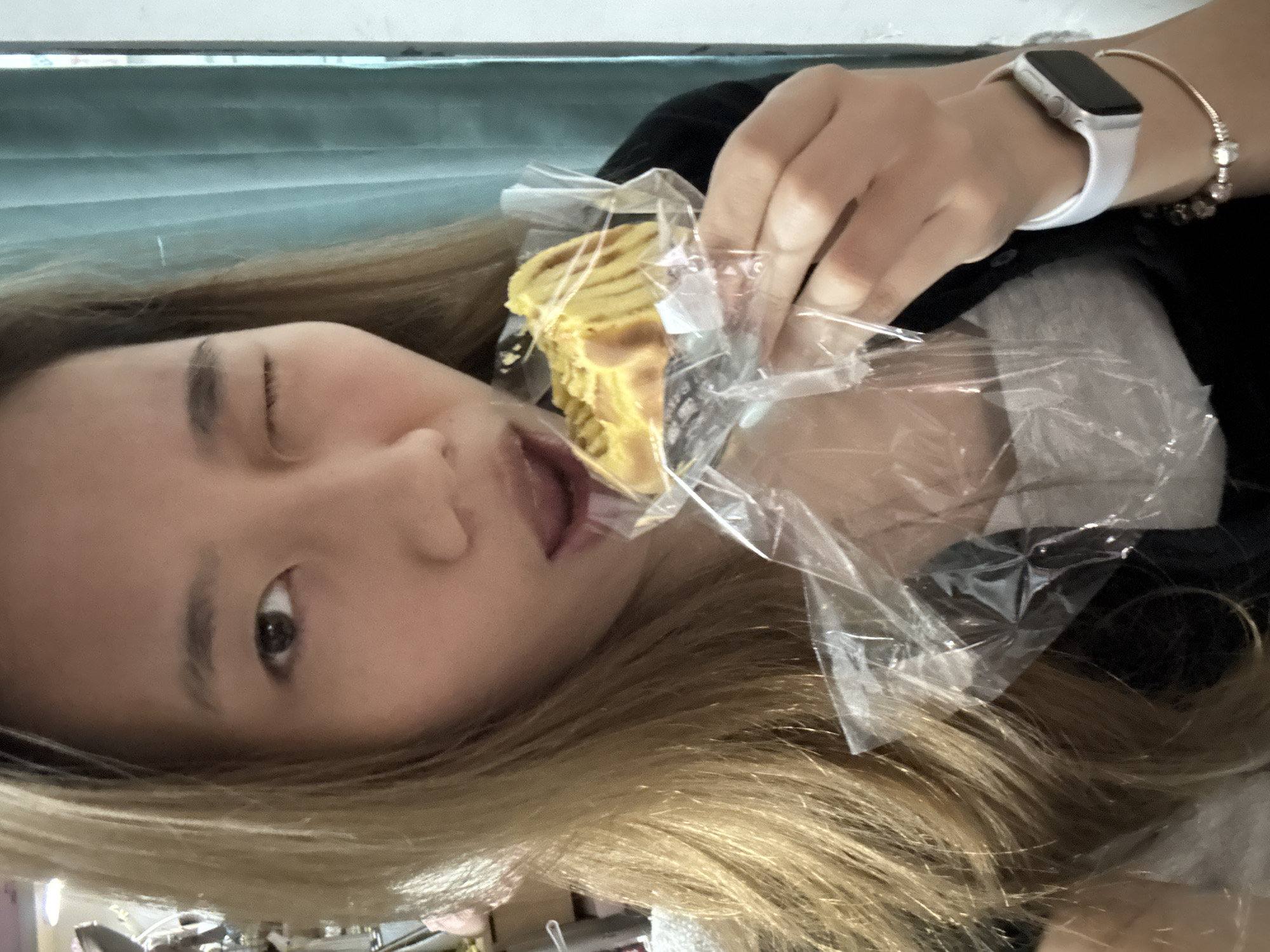 Woman poses with pastry in playful photos in Nan'an District