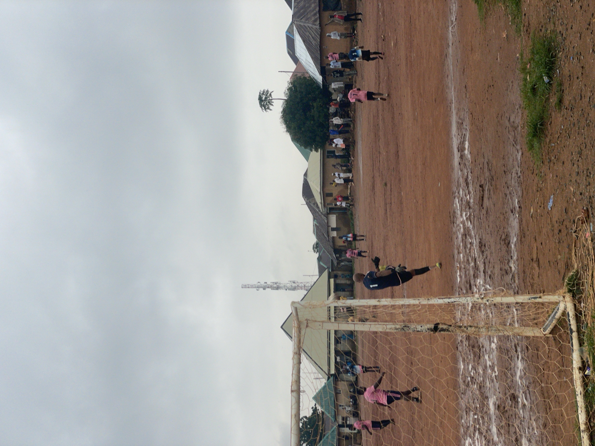 Rainy day in Kurunduma: football, street life, and nighttime gathering