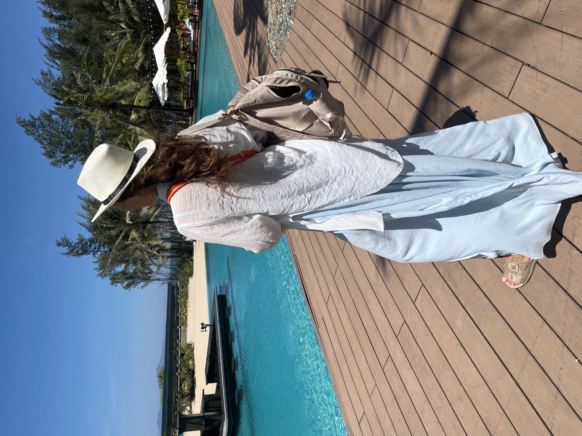 Woman photographs morning moments at Đà Nẵng tropical resort
