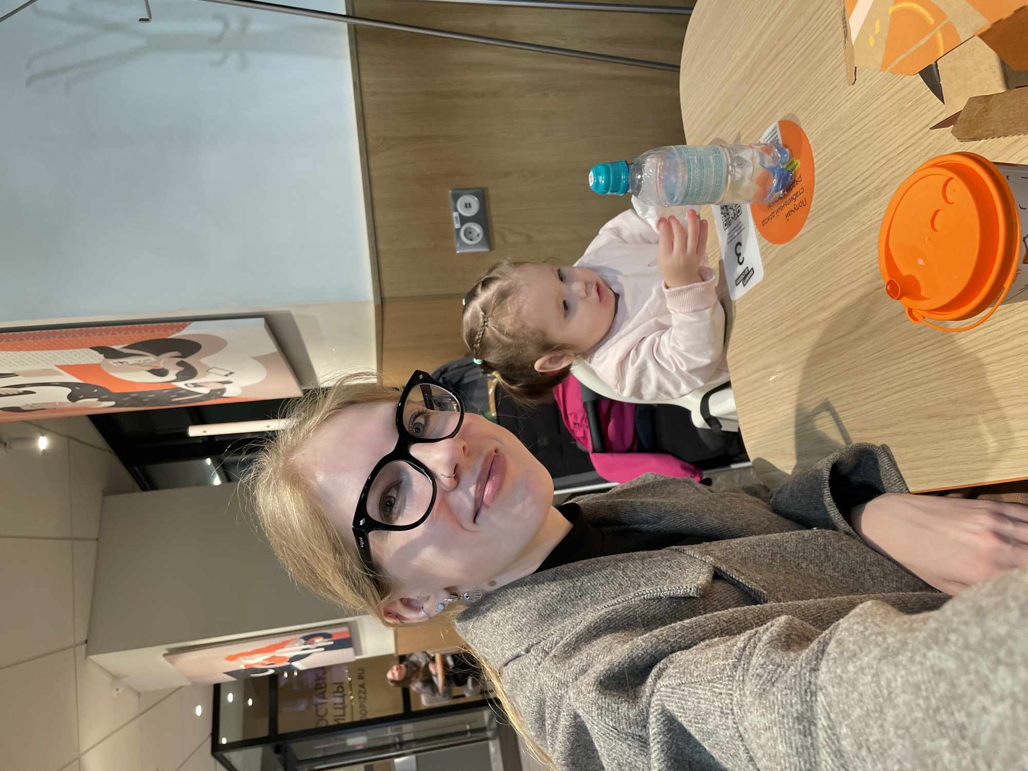 Mother and child share meal at Izhevsk restaurant