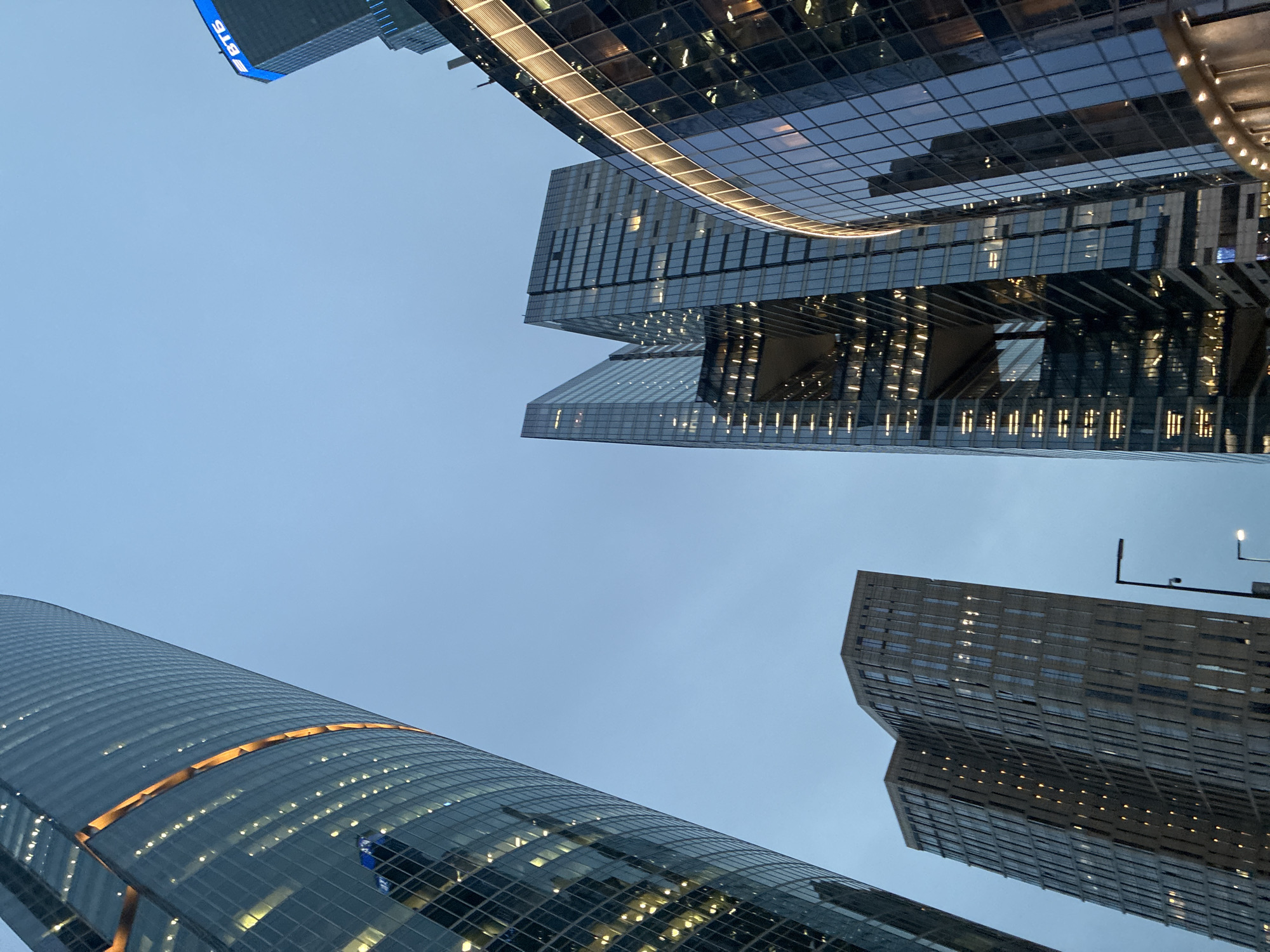 Glass skyscrapers rise into Moscow's cloudy twilight sky