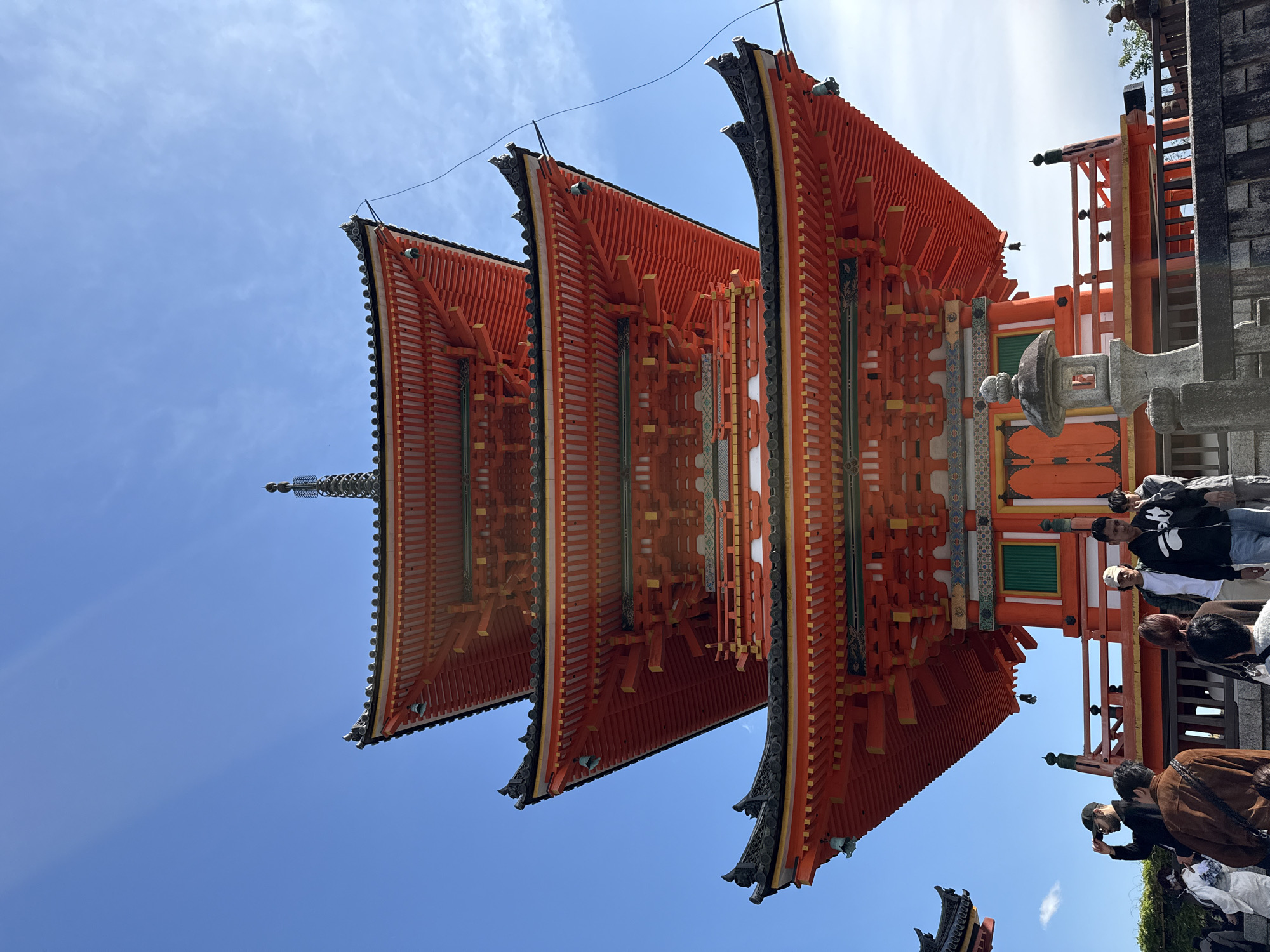 Traditional Kyoto pagoda documented by visitors during morning hours