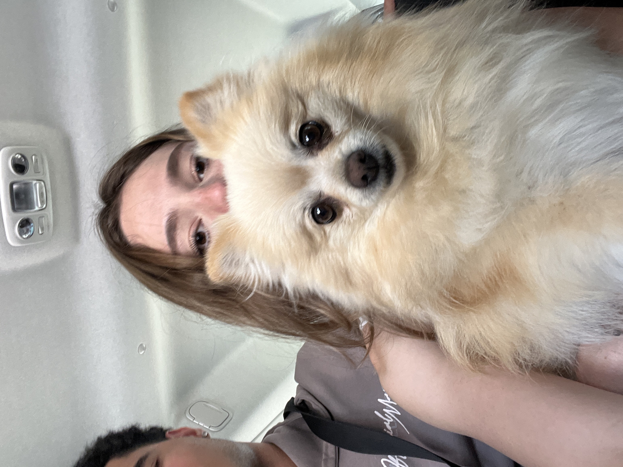 Woman poses with Pomeranian dog in Mexican town