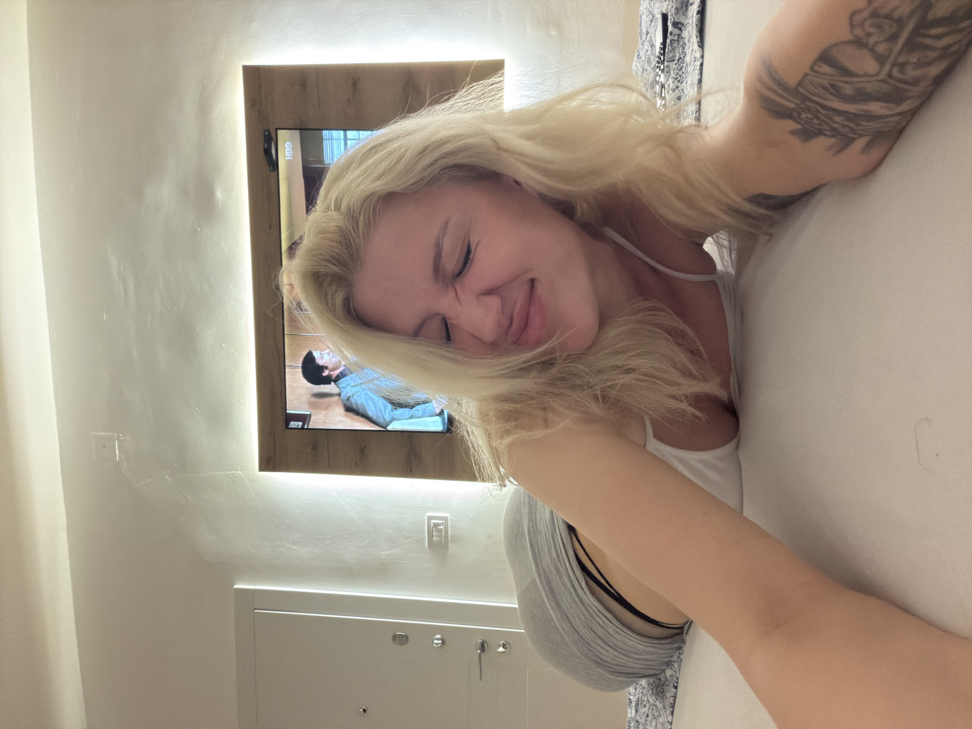 Woman resting in Belgrade bedroom Saturday evening