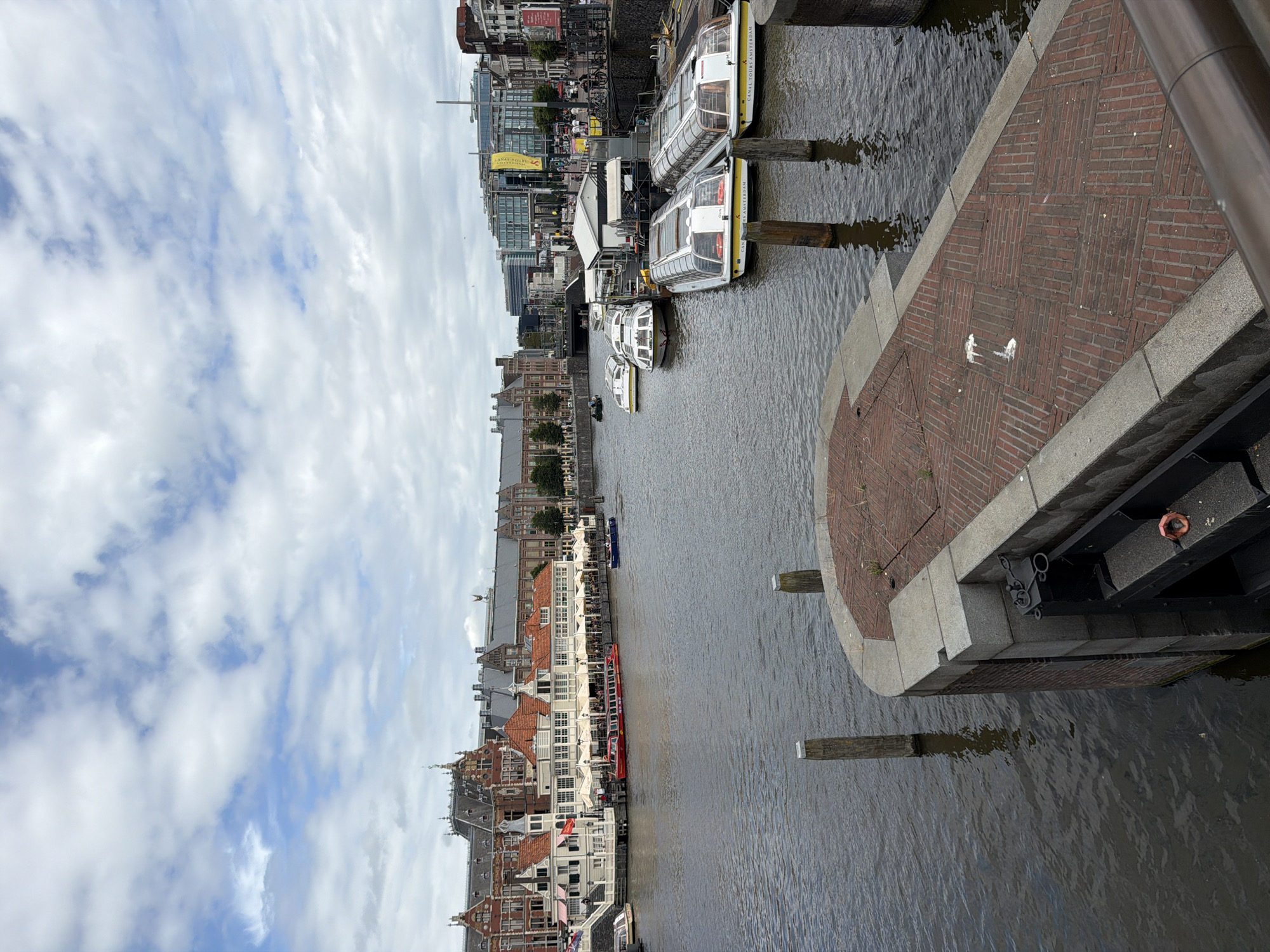 Amsterdam canals and streets on a busy summer afternoon
