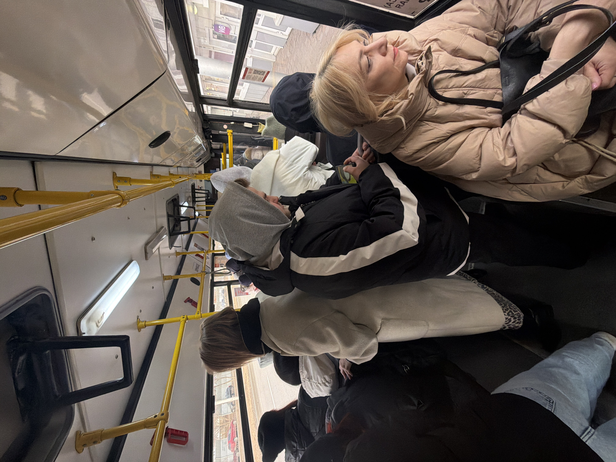 Ordinary moments captured in Krasnoyarsk: bus passengers, elevator selfie