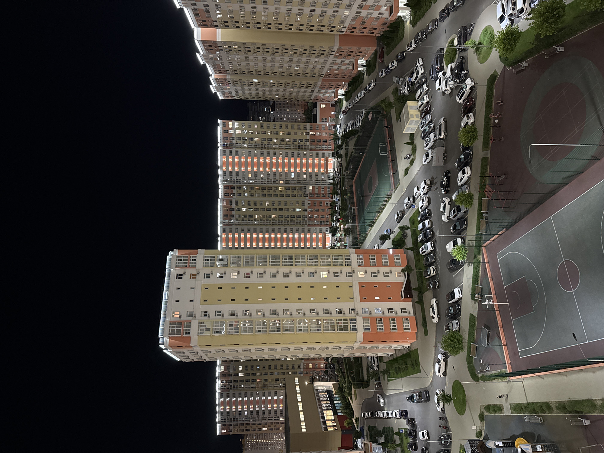 Anapa residential complex at night, courts and playground included