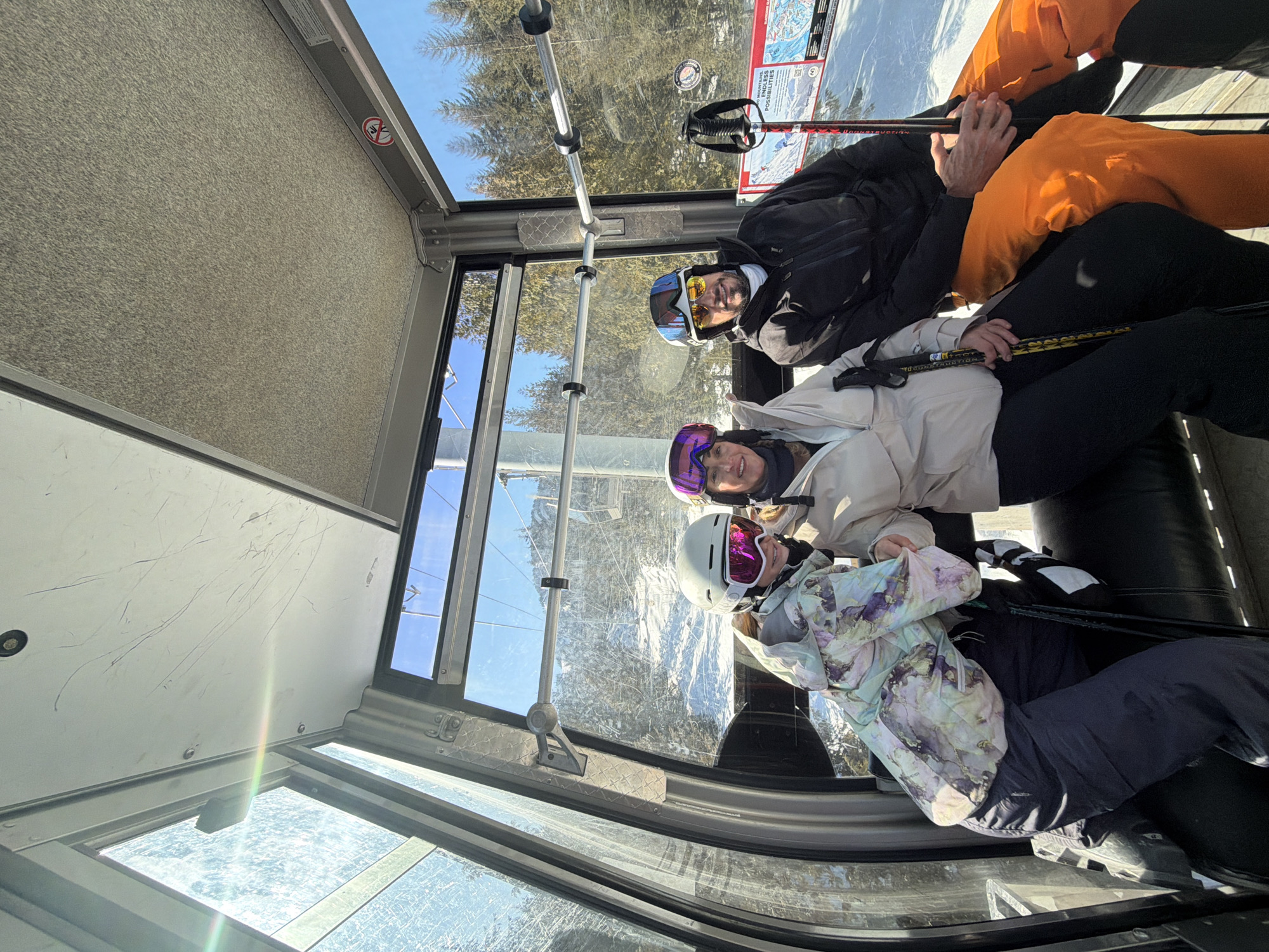 Skiers ride gondola lifts at Whistler resort