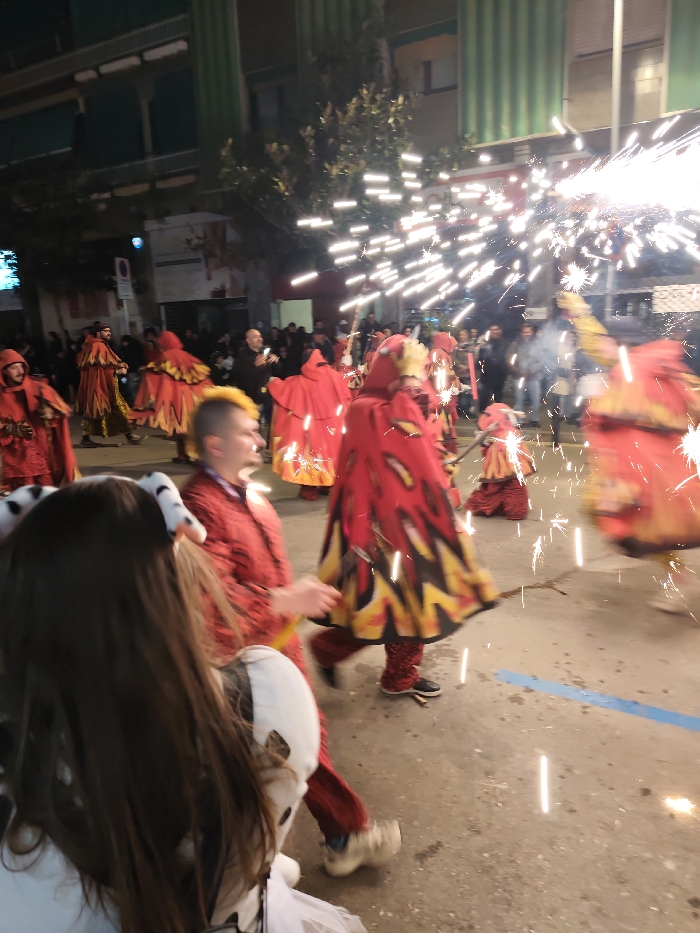 Costumed carnival parade fills streets of Ripollet, Spain