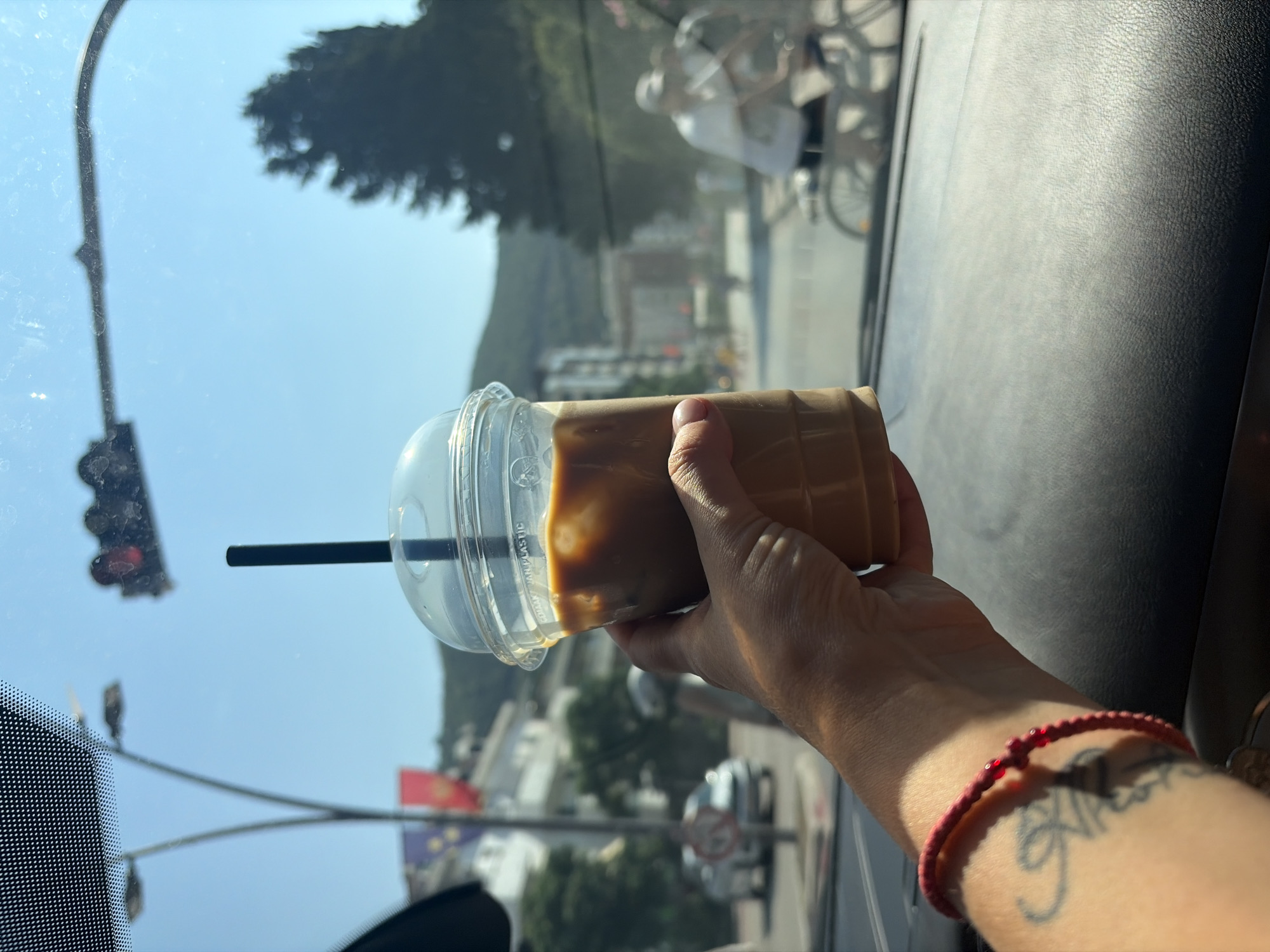 Iced coffee and summer vibes on the road in Budva