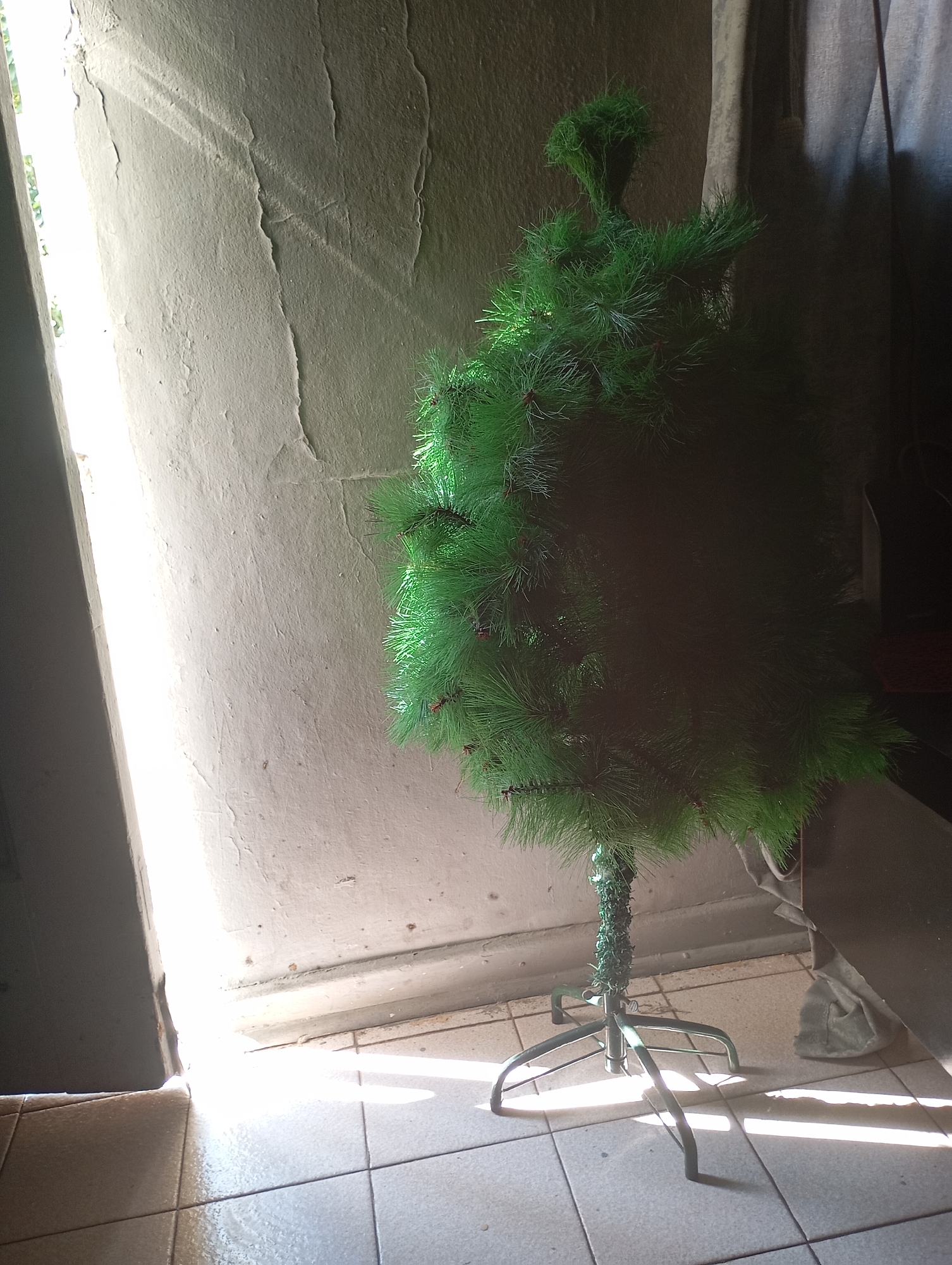 Artificial Christmas tree partially assembled indoors in Johannesburg