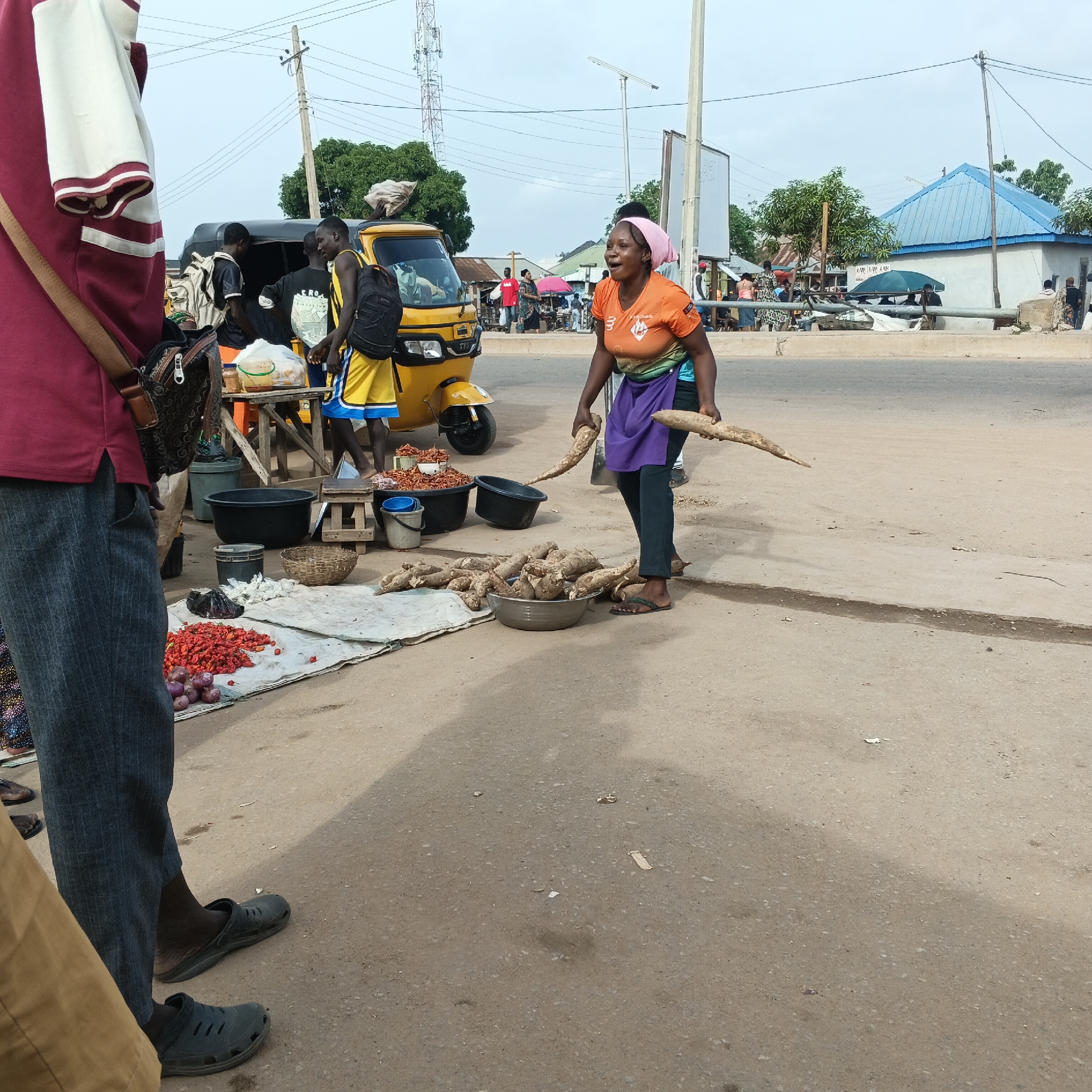 Morning market activity in Rido, Nigeria features cassava vendors