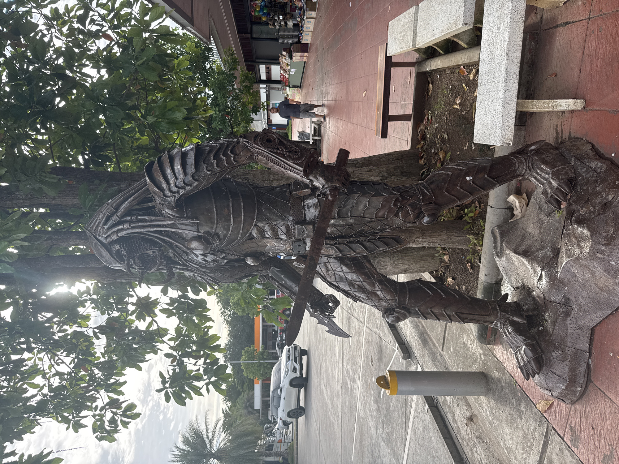 Scrap metal pop culture sculptures at a Thai roadside stop