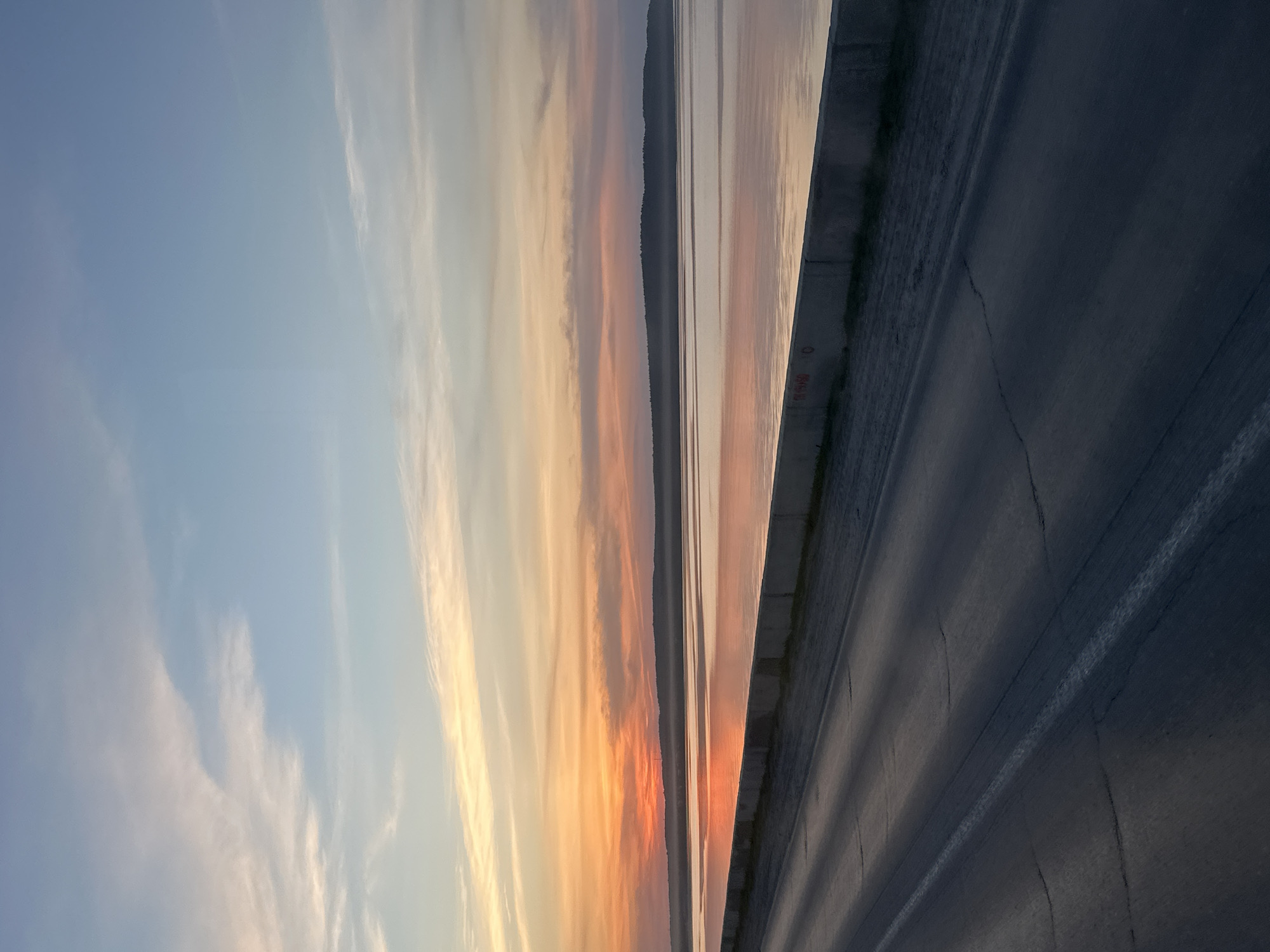 Evening scenes captured across Chaikovsky, Russia include cyclist, sunset roads