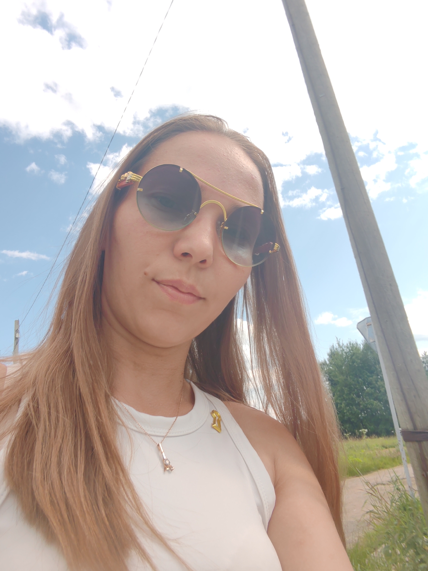 Roadside stop in Chukhloma: birches, a rural road, and a domed church