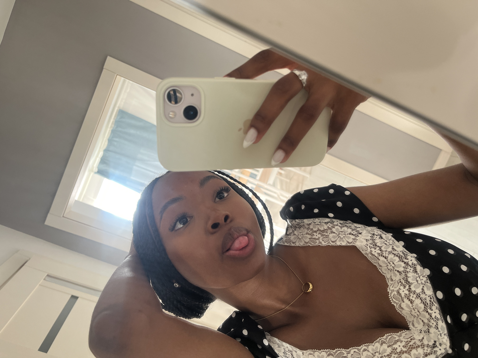 Woman takes mirror selfies in polka dot dress, Kazan