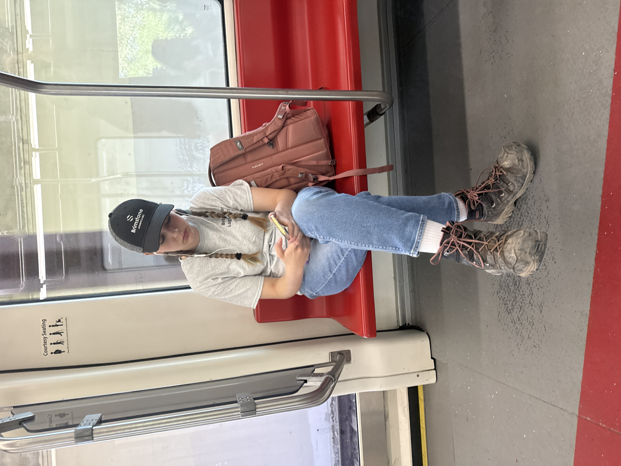 Passing time on Calgary transit, phone in hand