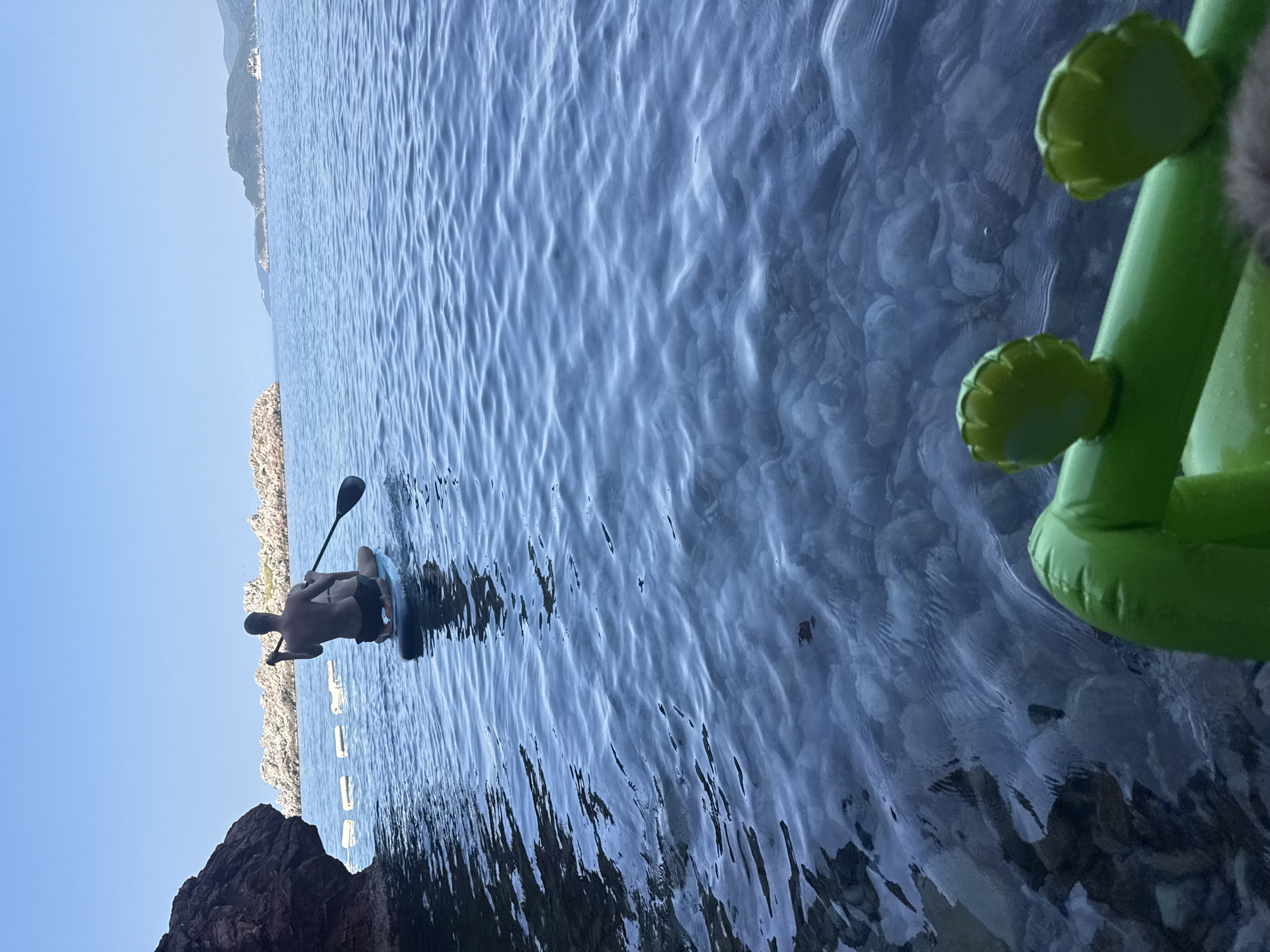 Paddleboarding the clear Adriatic waters off Sveti Stefan