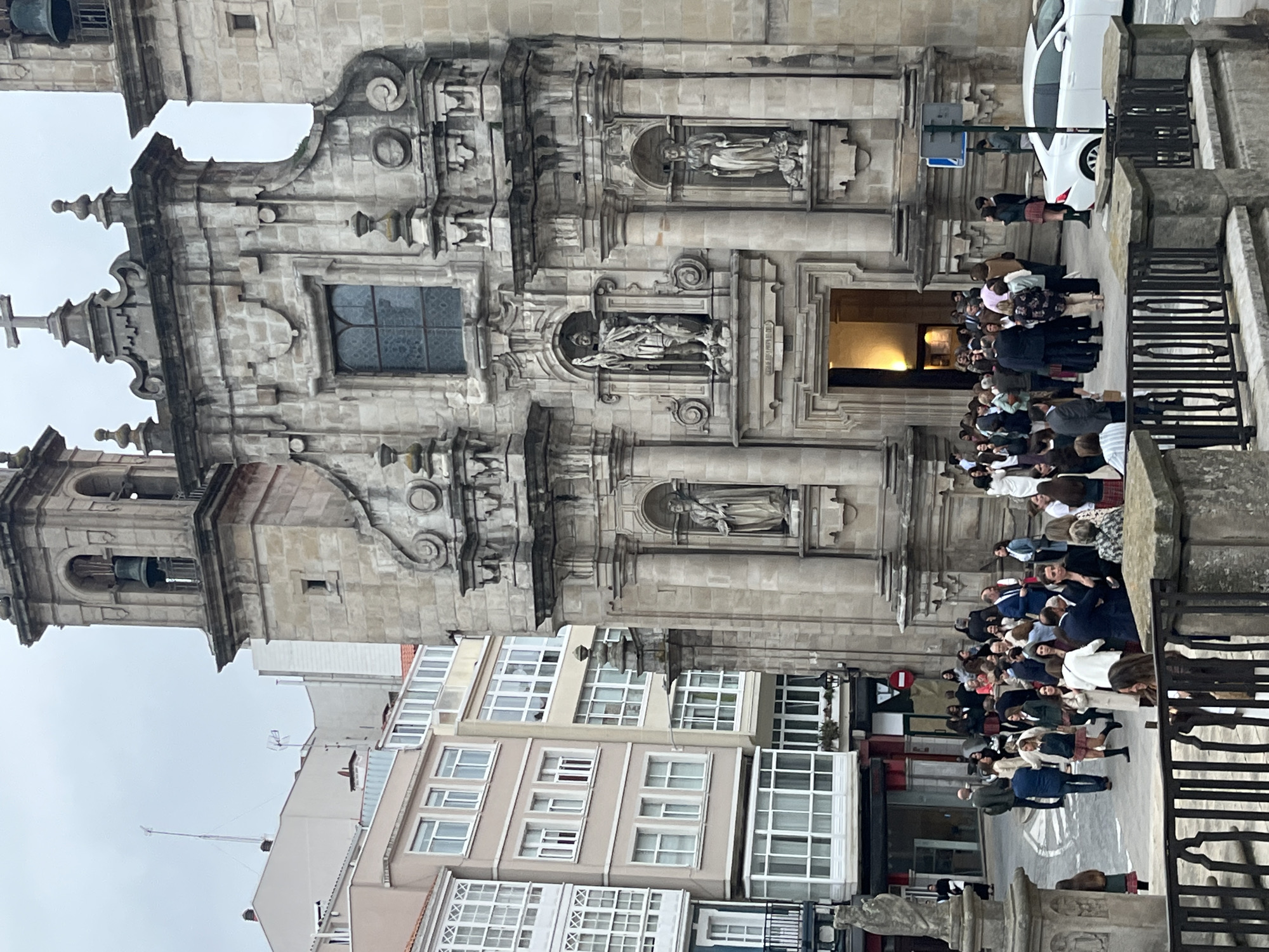 Crowd gathers at baroque church in A Coruña, Spain